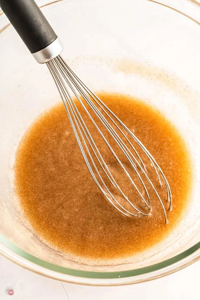 bowl of sauce and whisk