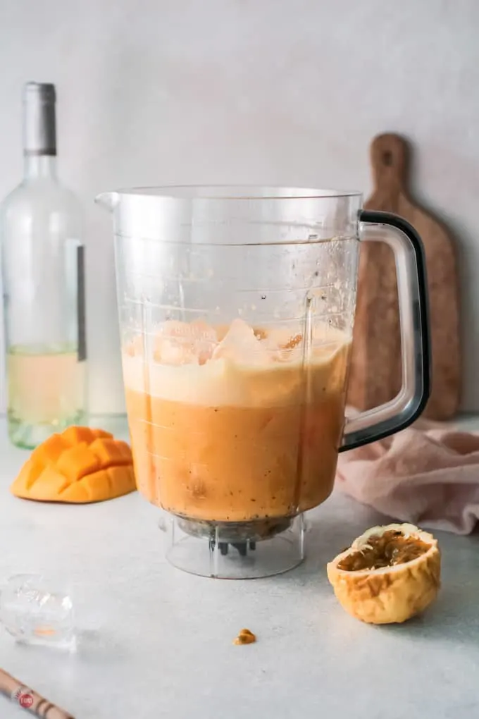 mango and wine in a blender