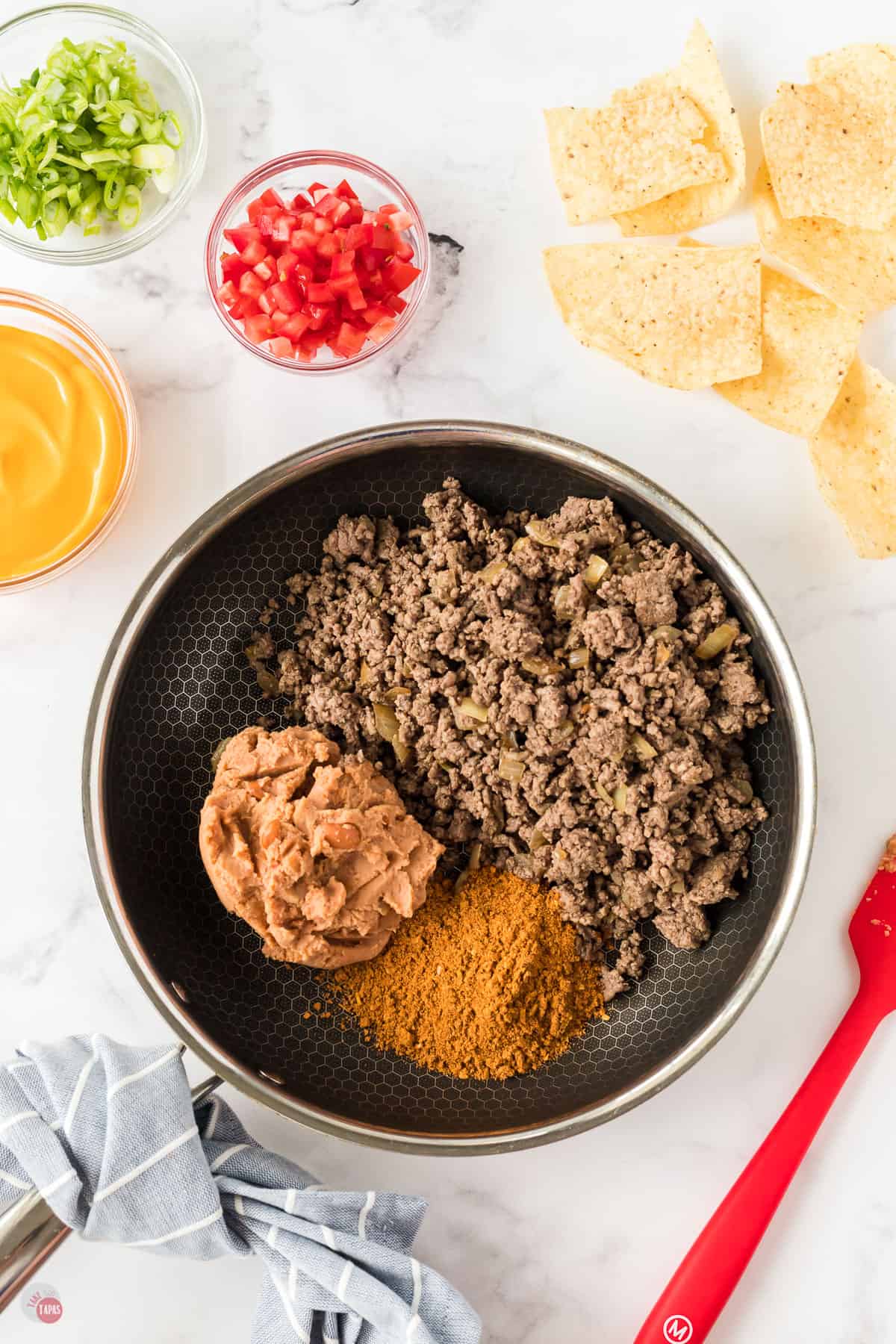 meat and beans in pan