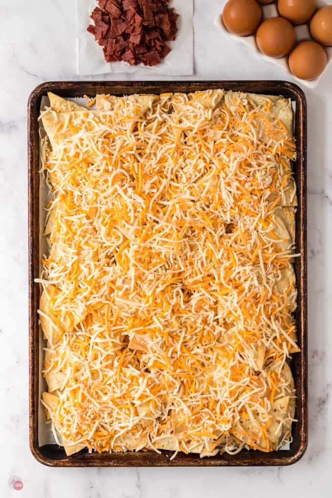 cheese and chips on a baking sheet