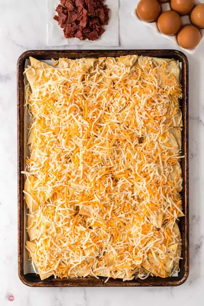 cheese and chips on a baking sheet