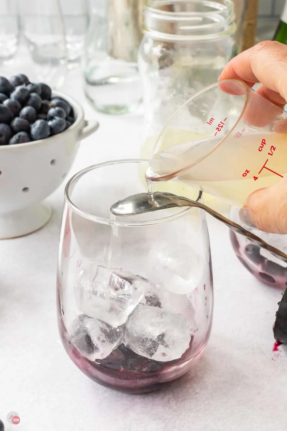 juice pouring over spoon