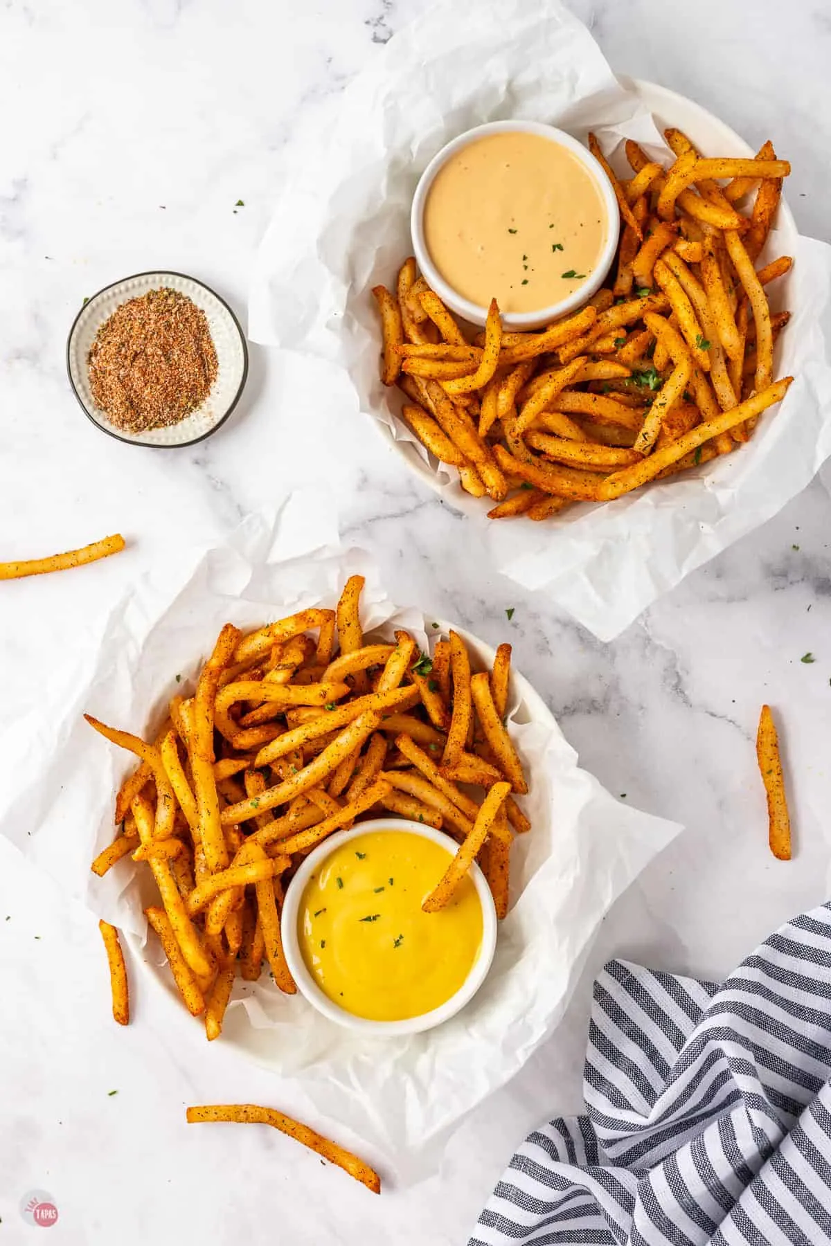 two bowls of french fries