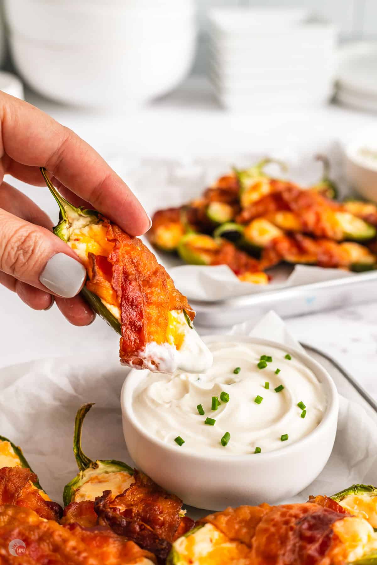 popper dipping in sour cream