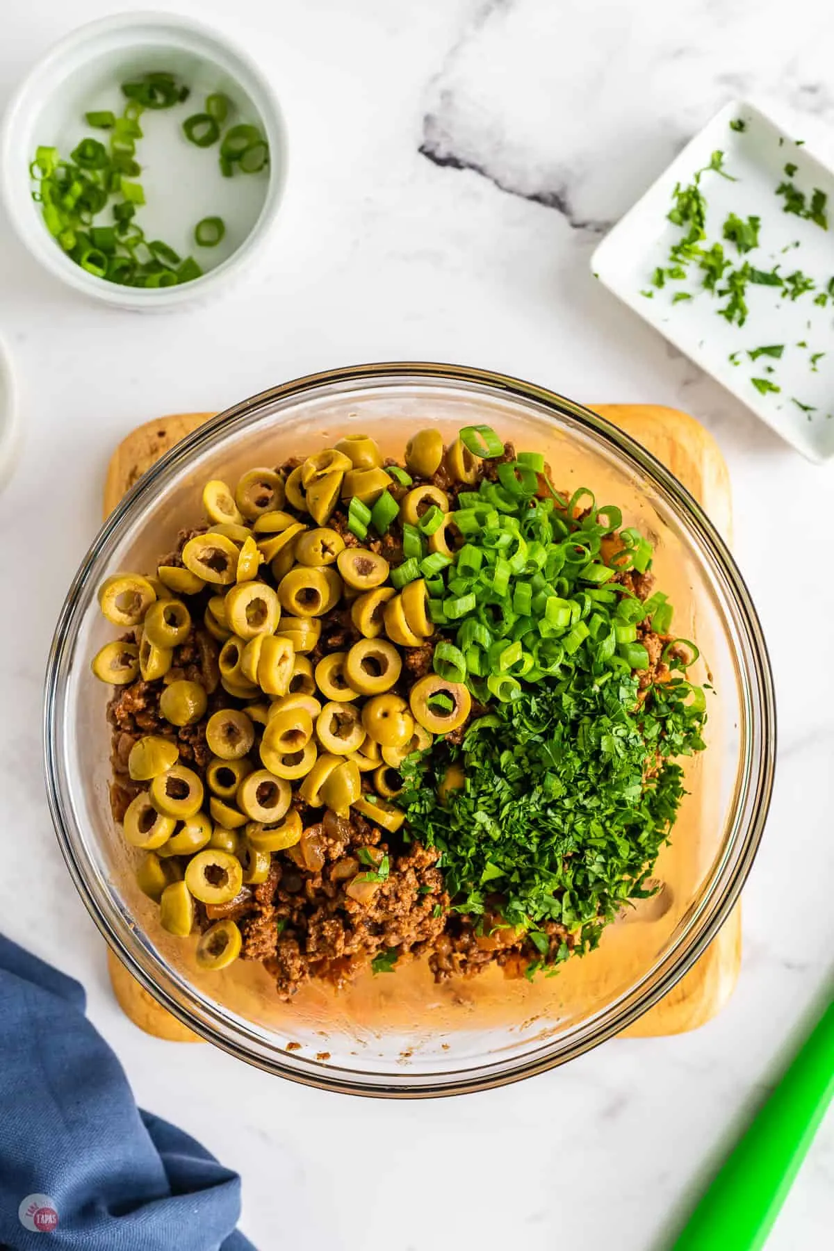 beef and olives in a bowl