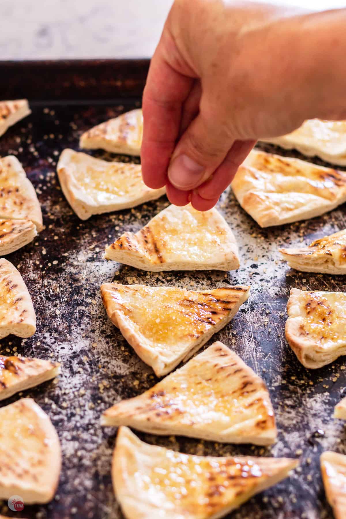 pita chips on a baking sheet