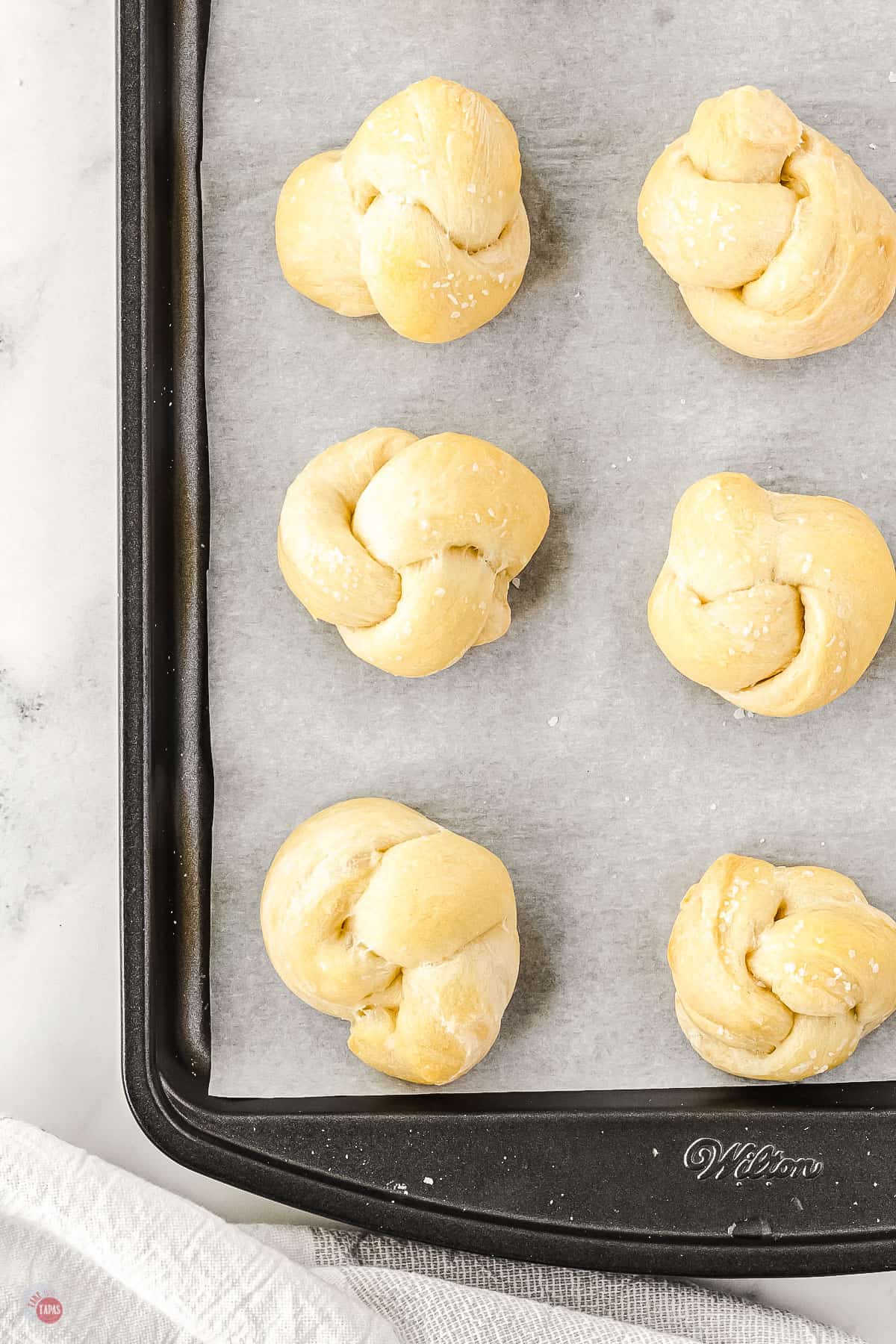 baked garlic knots on a pan