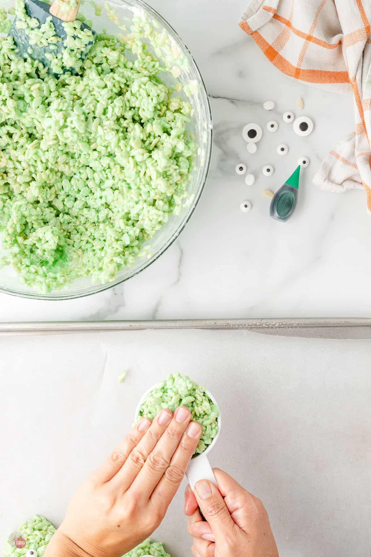 measuring cup full of green rice cereal