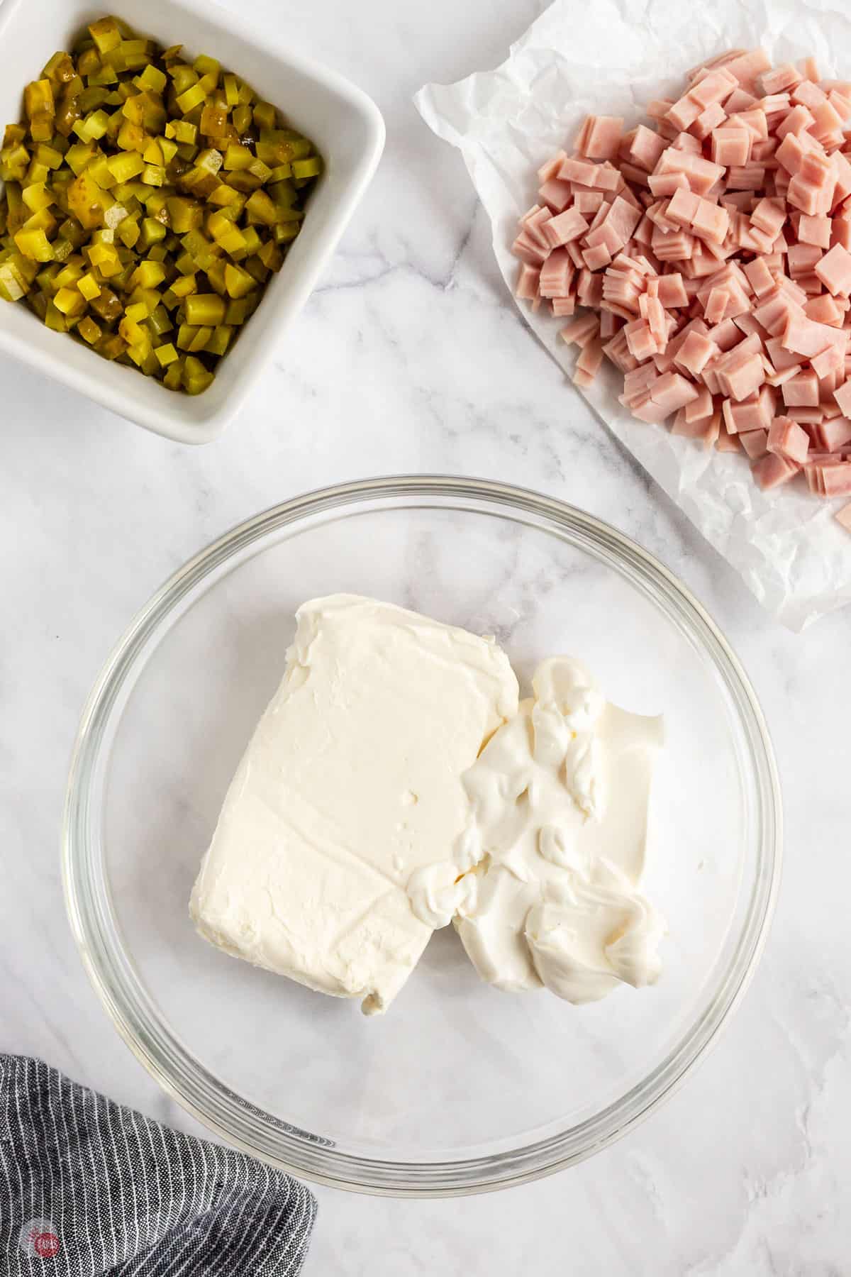 cream cheese and sour cream in a bowl