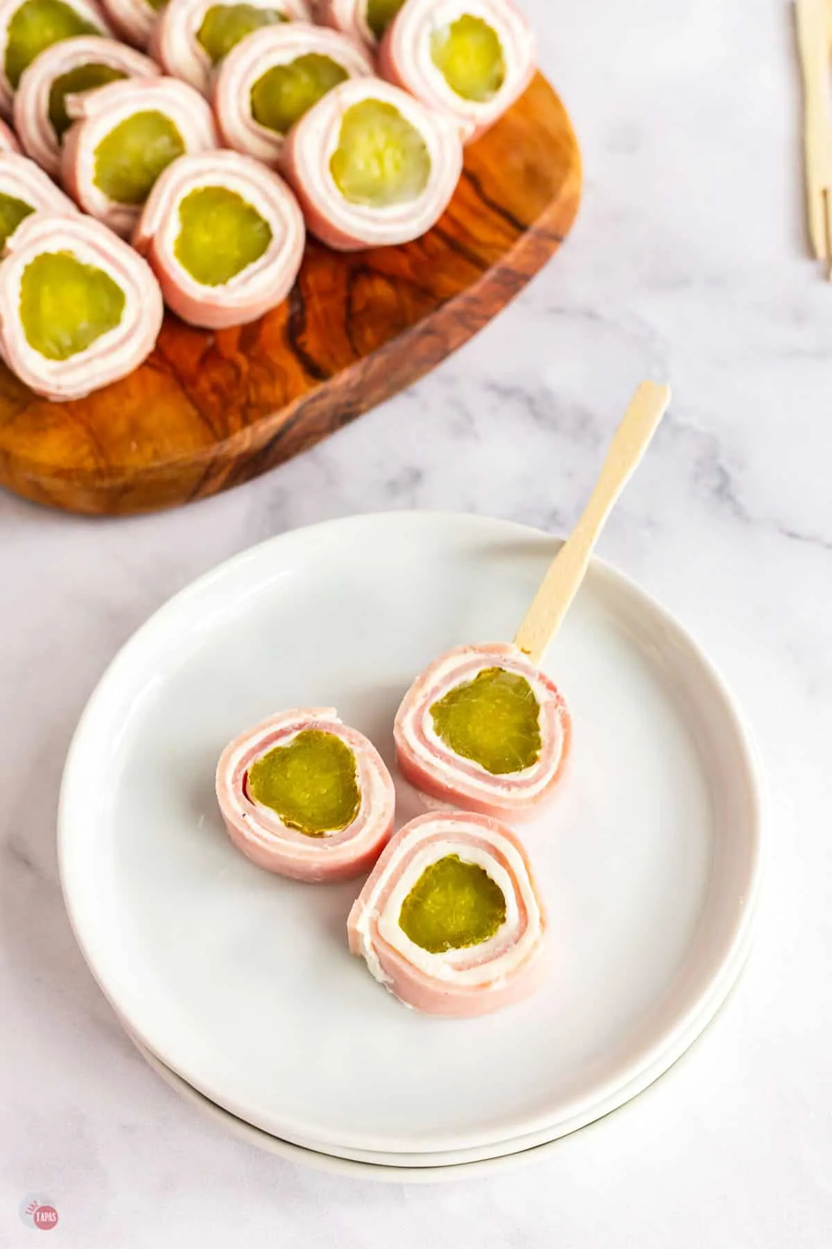 plate of ham and pickle roll ups