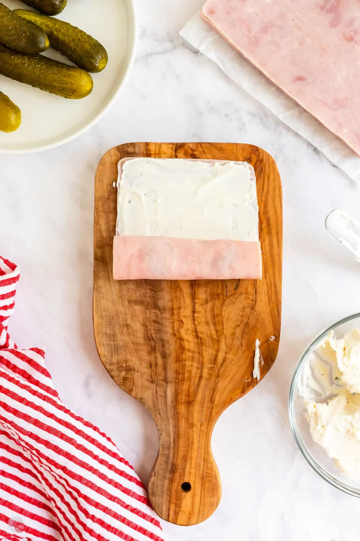 cream cheese on a slice of ham