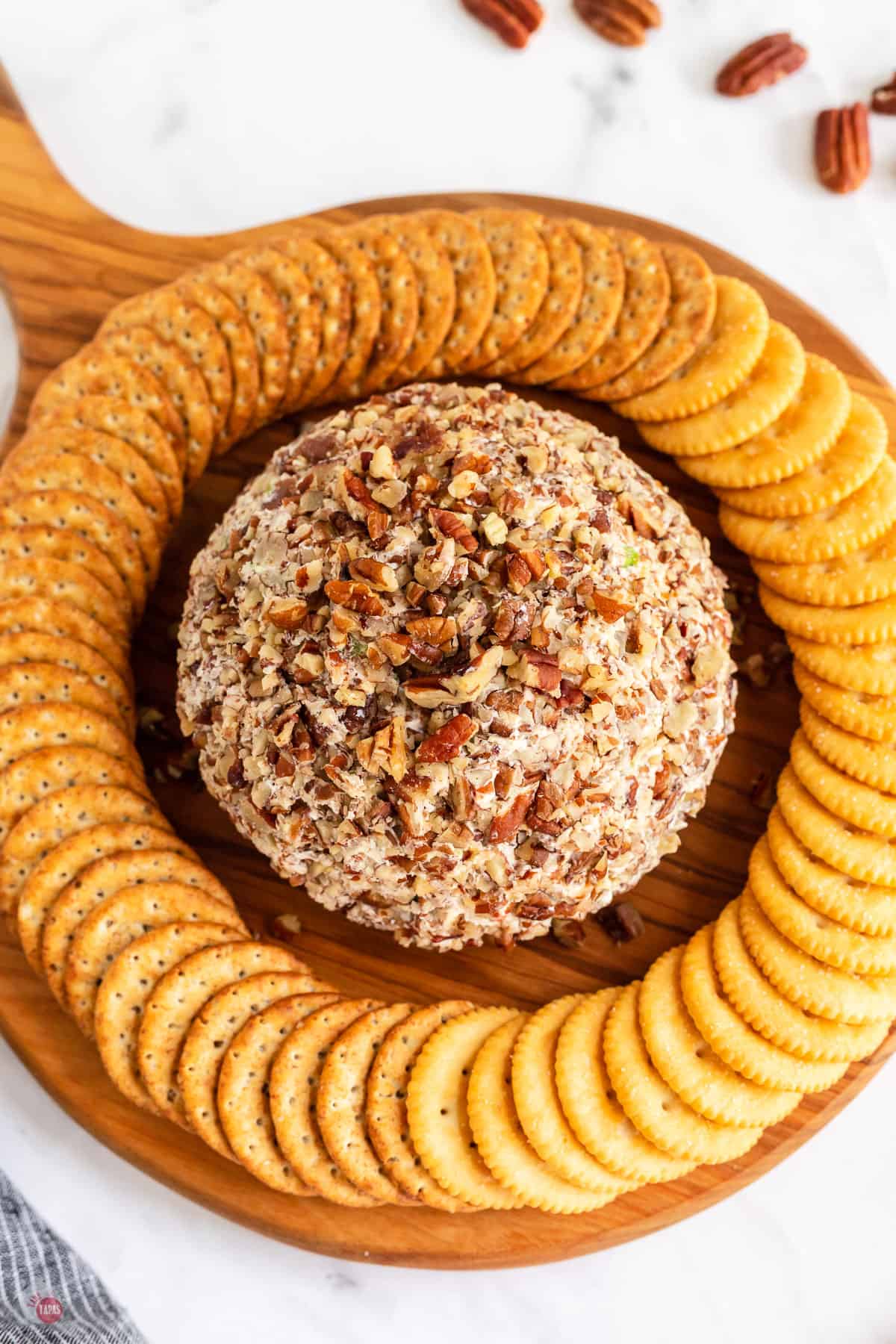 cheese ball on platter with crackers