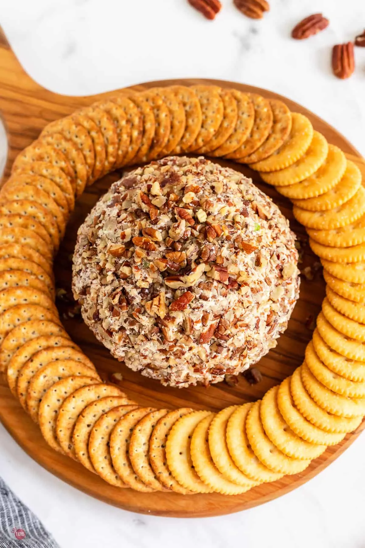 cheese ball on platter with crackers