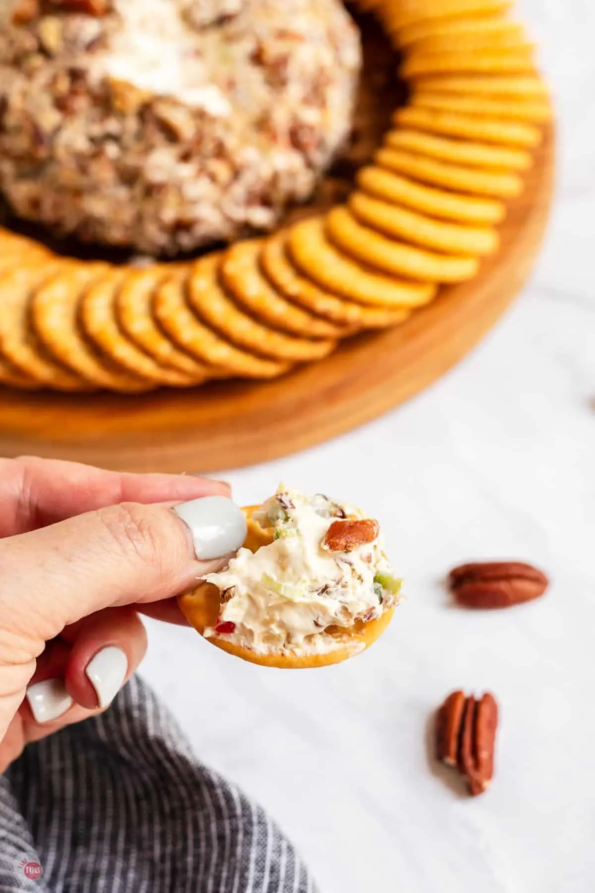 cracker smeared with pineapple cheese ball