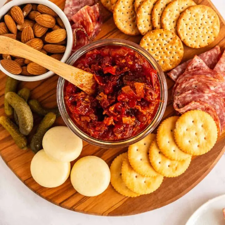 cheese board with jar of tomato bacon jam