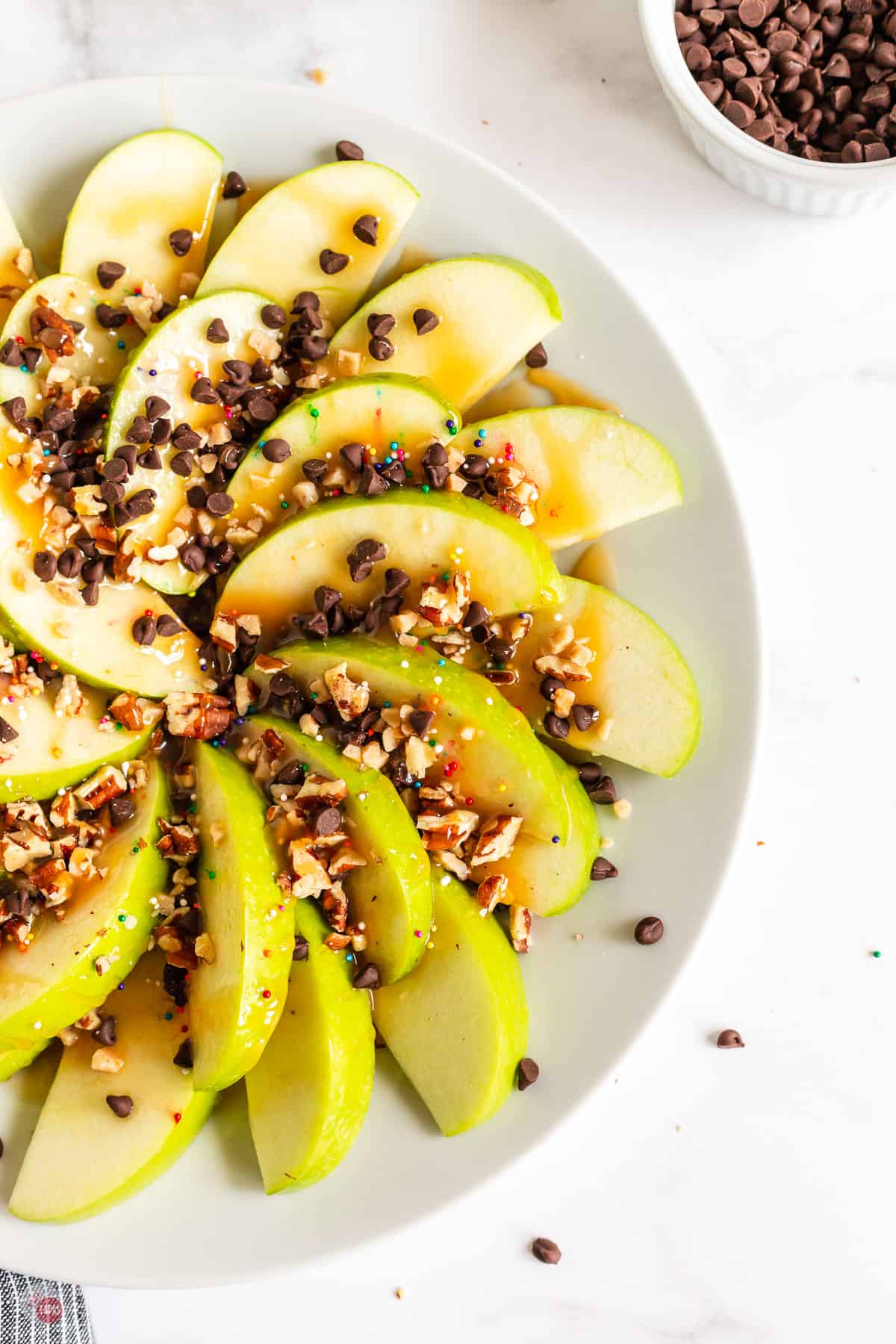 plate of nachos with apples