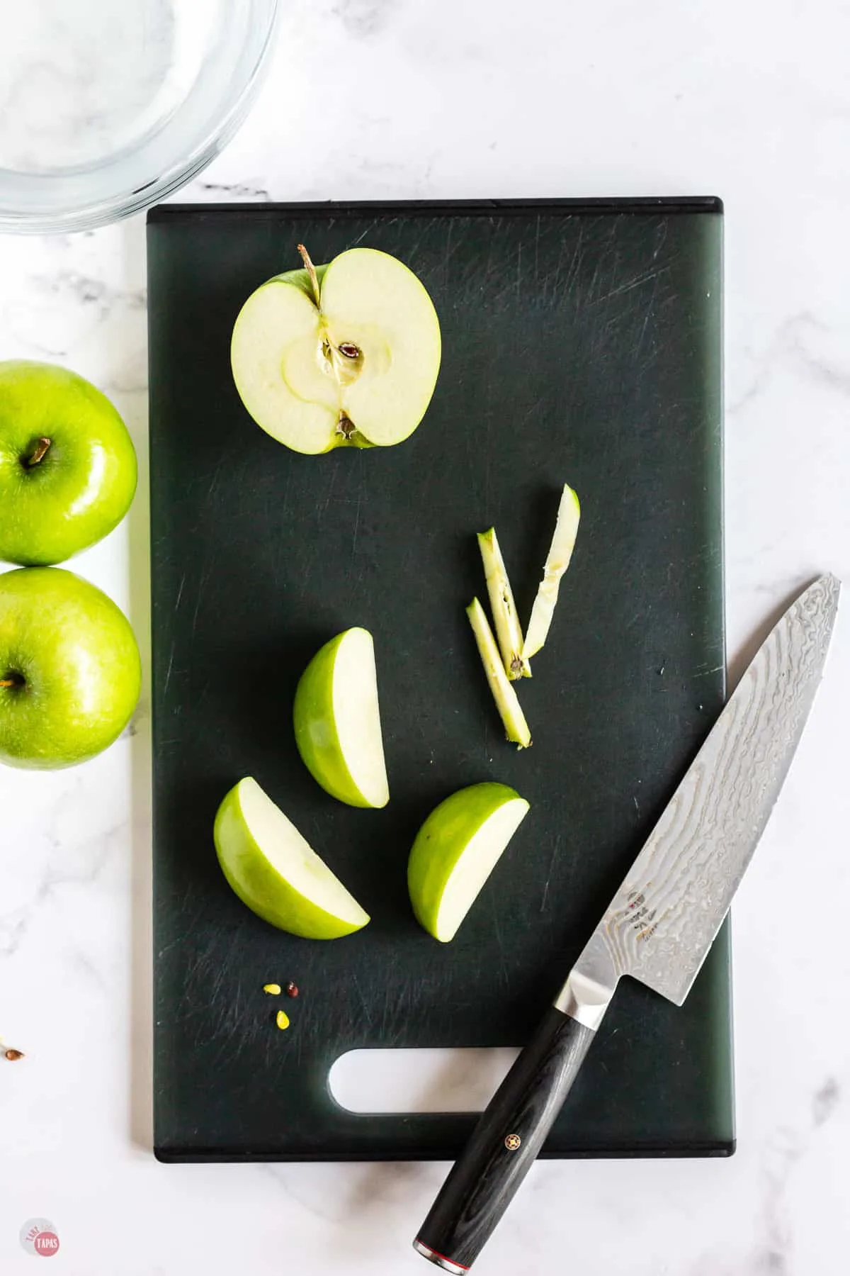 cut apples on a cutting board