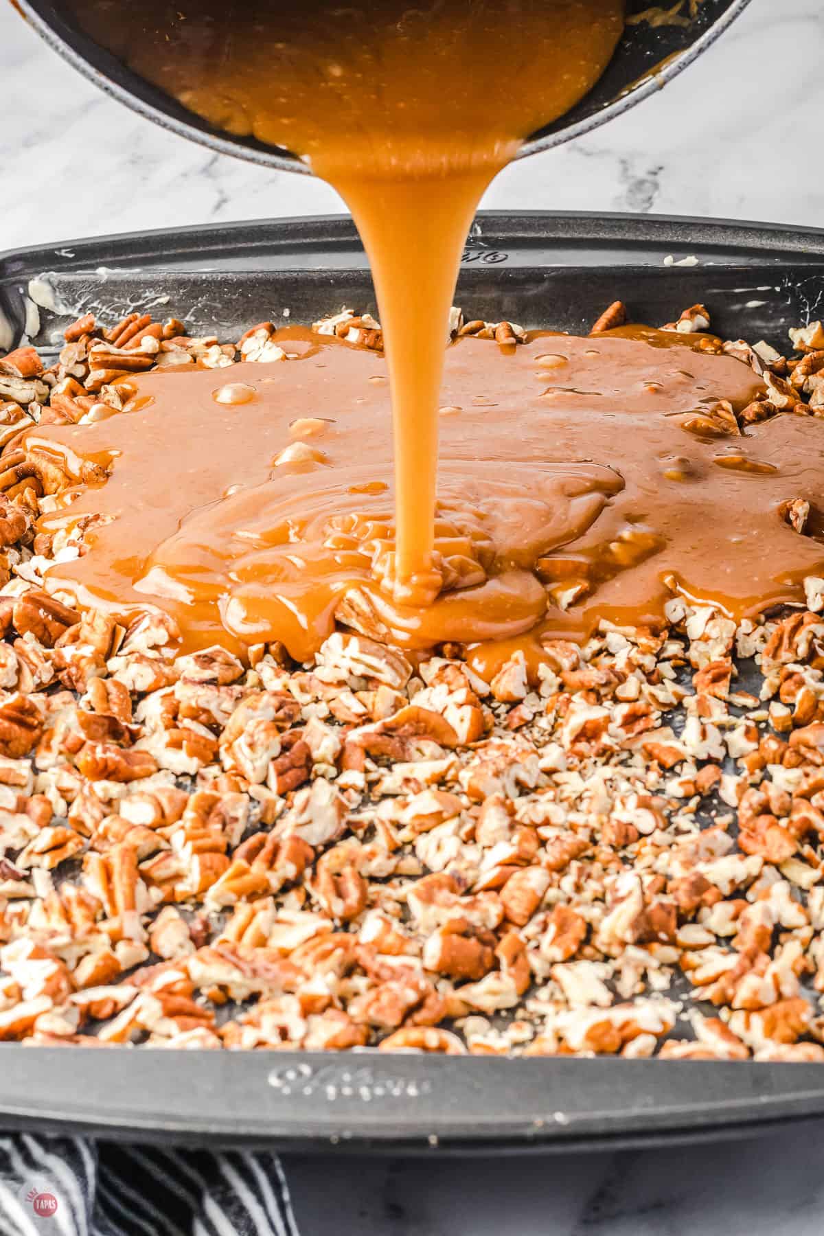 pouring candy on pecans