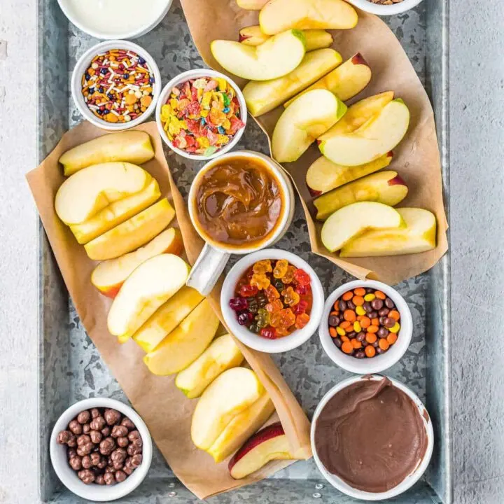 tray with apples and toppings