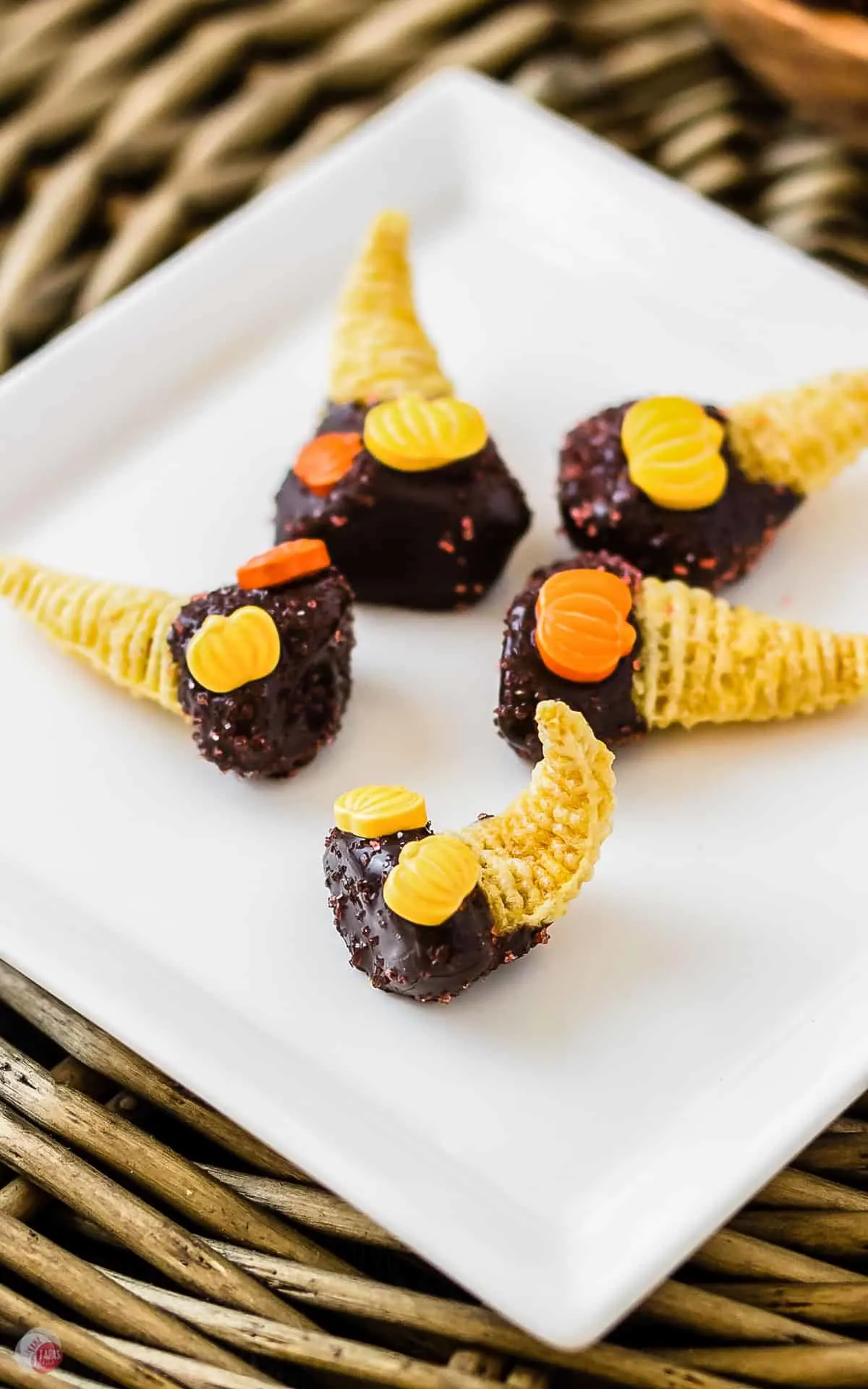 closeup of bugles with chocolate on a white plate