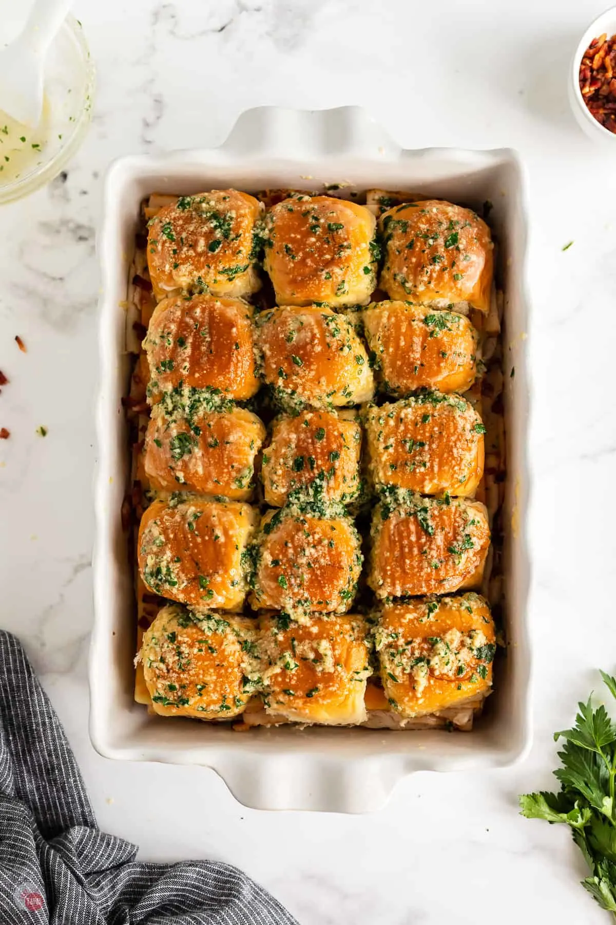 coated sliders in a pan