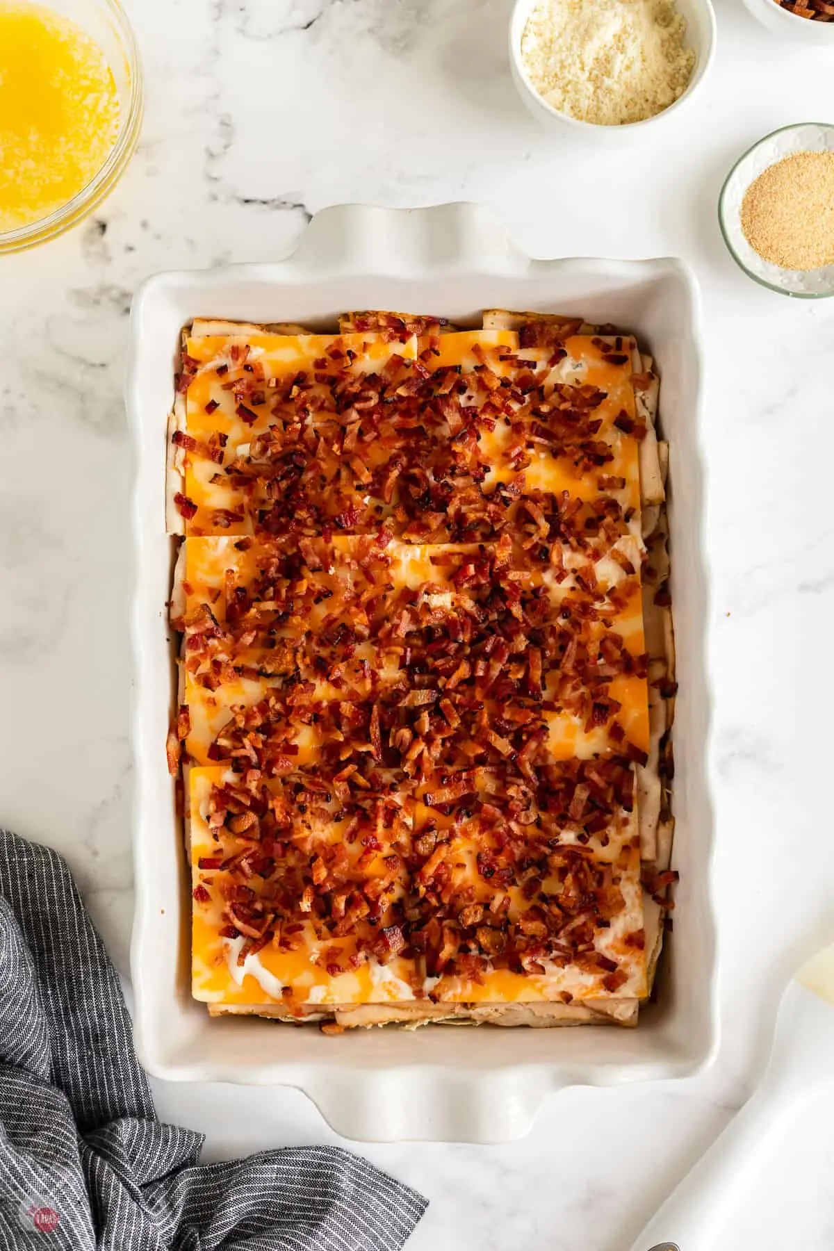 bacon on cheese in pan