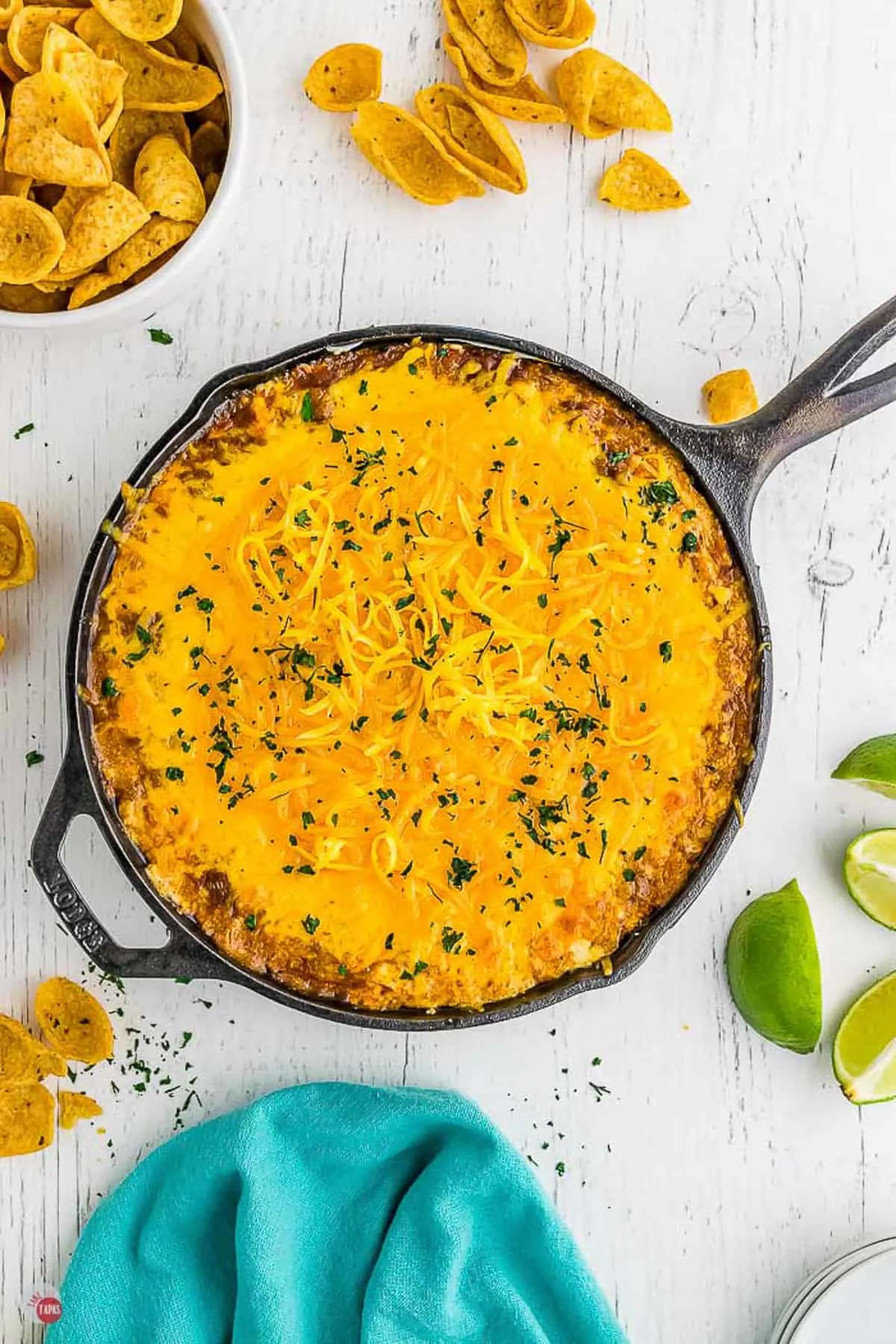 overhead shot of chili cheese dip in a black skillet