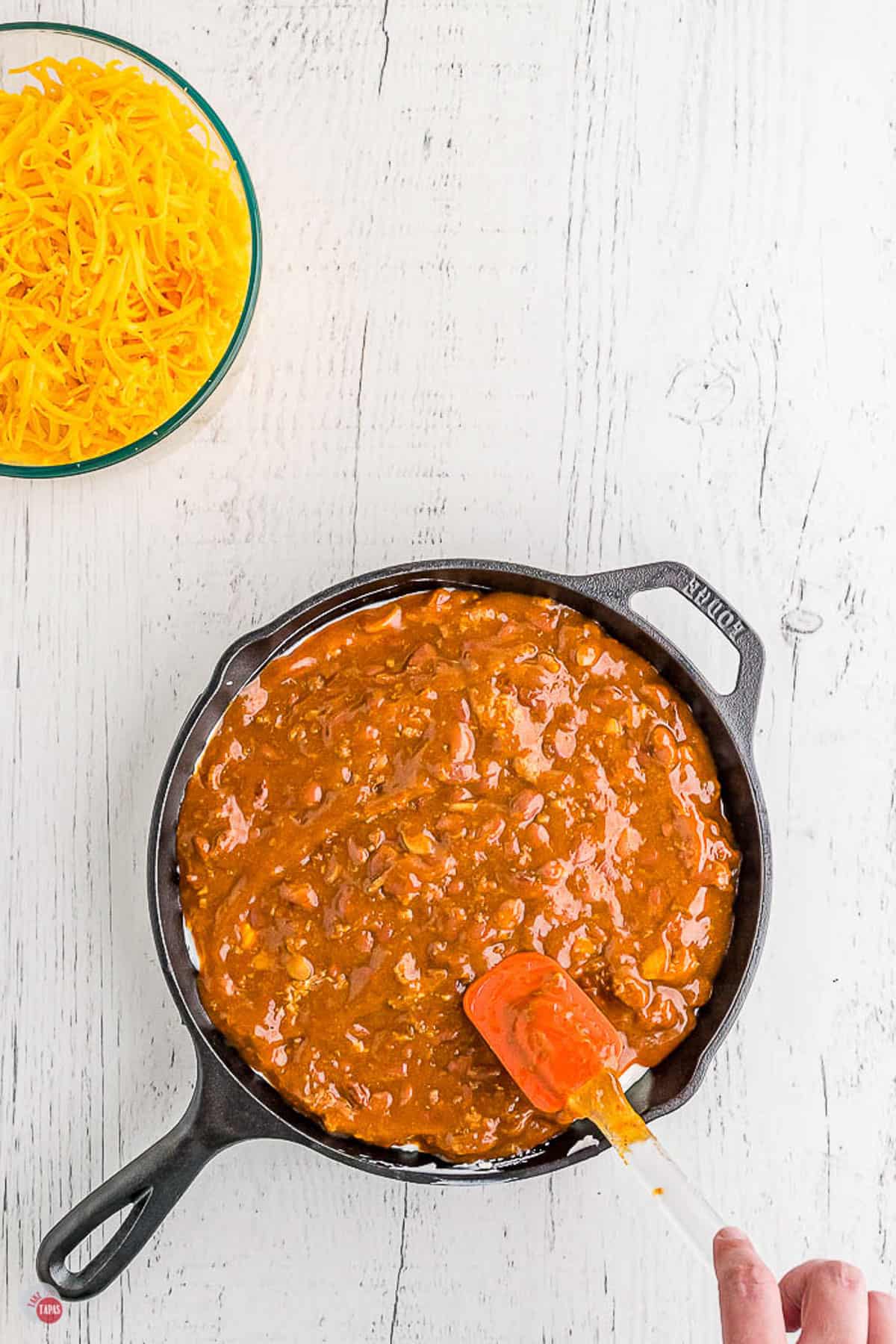 chili in a skillet with a spatula