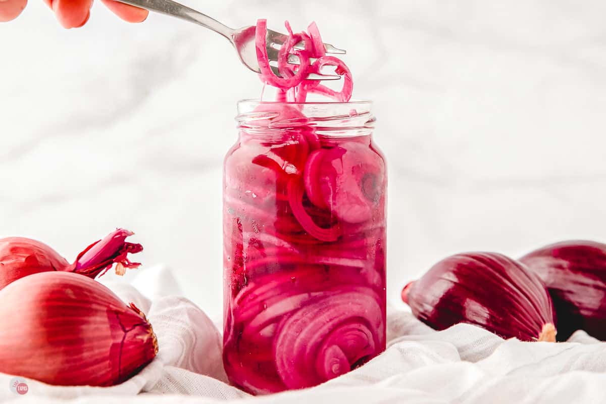 straight on shot of jar of pickled red onions