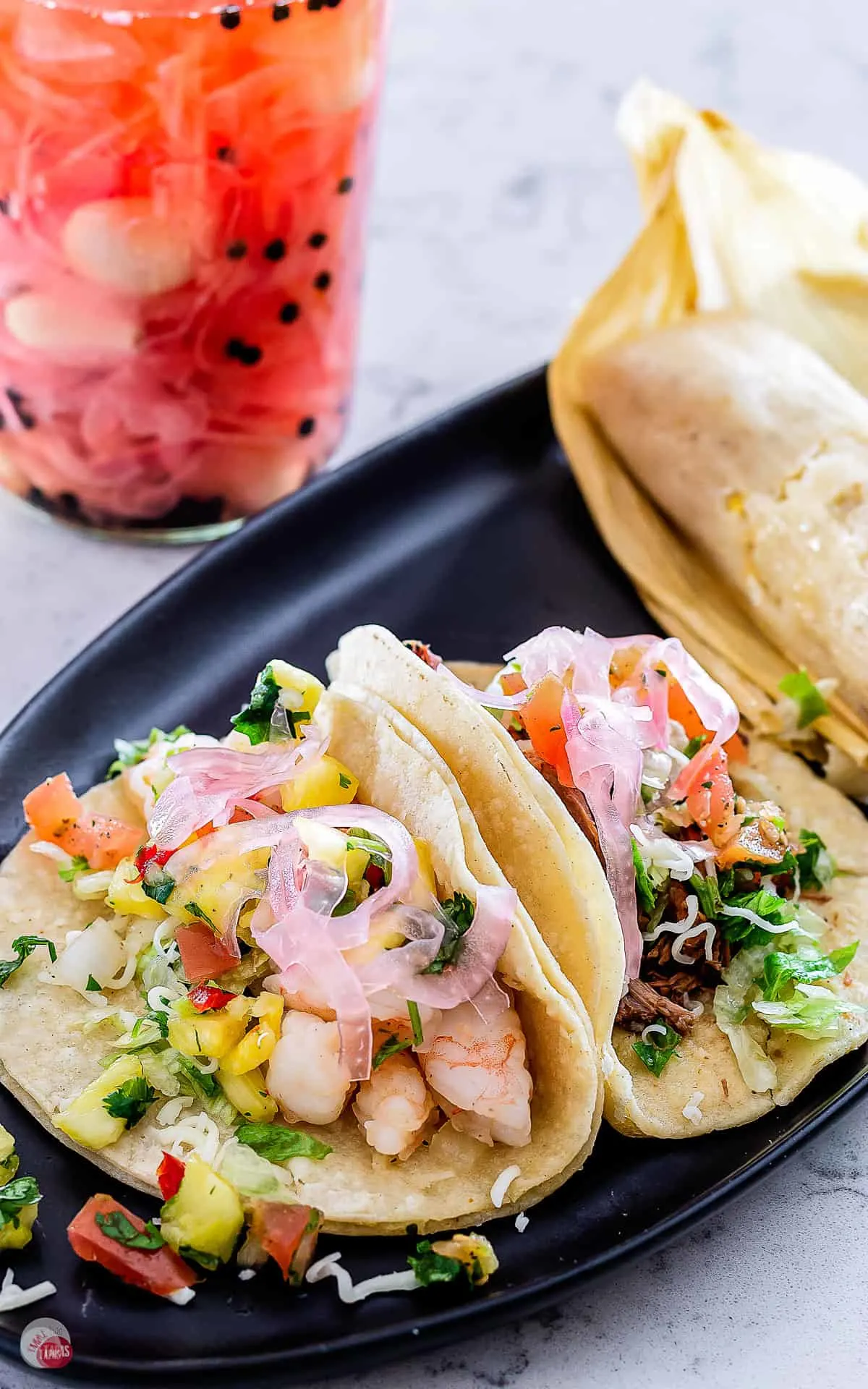 plate of tacos topped with easy pickled red onions