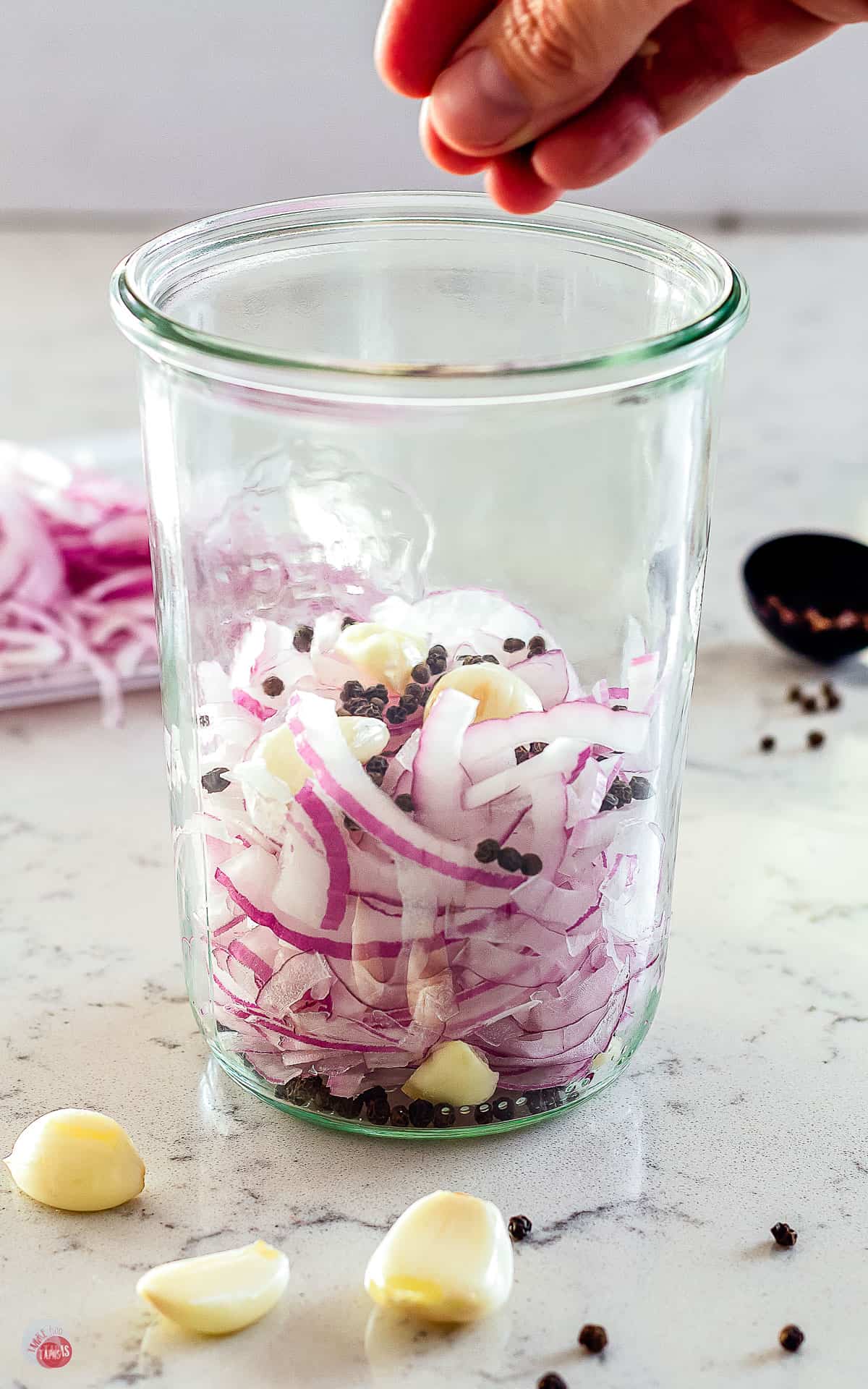 sliced onions in a jar