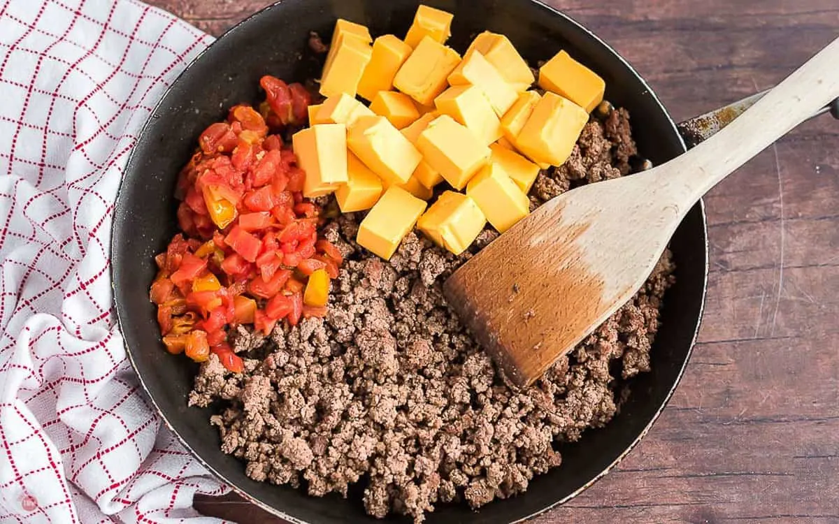 beef and cheese in a pan