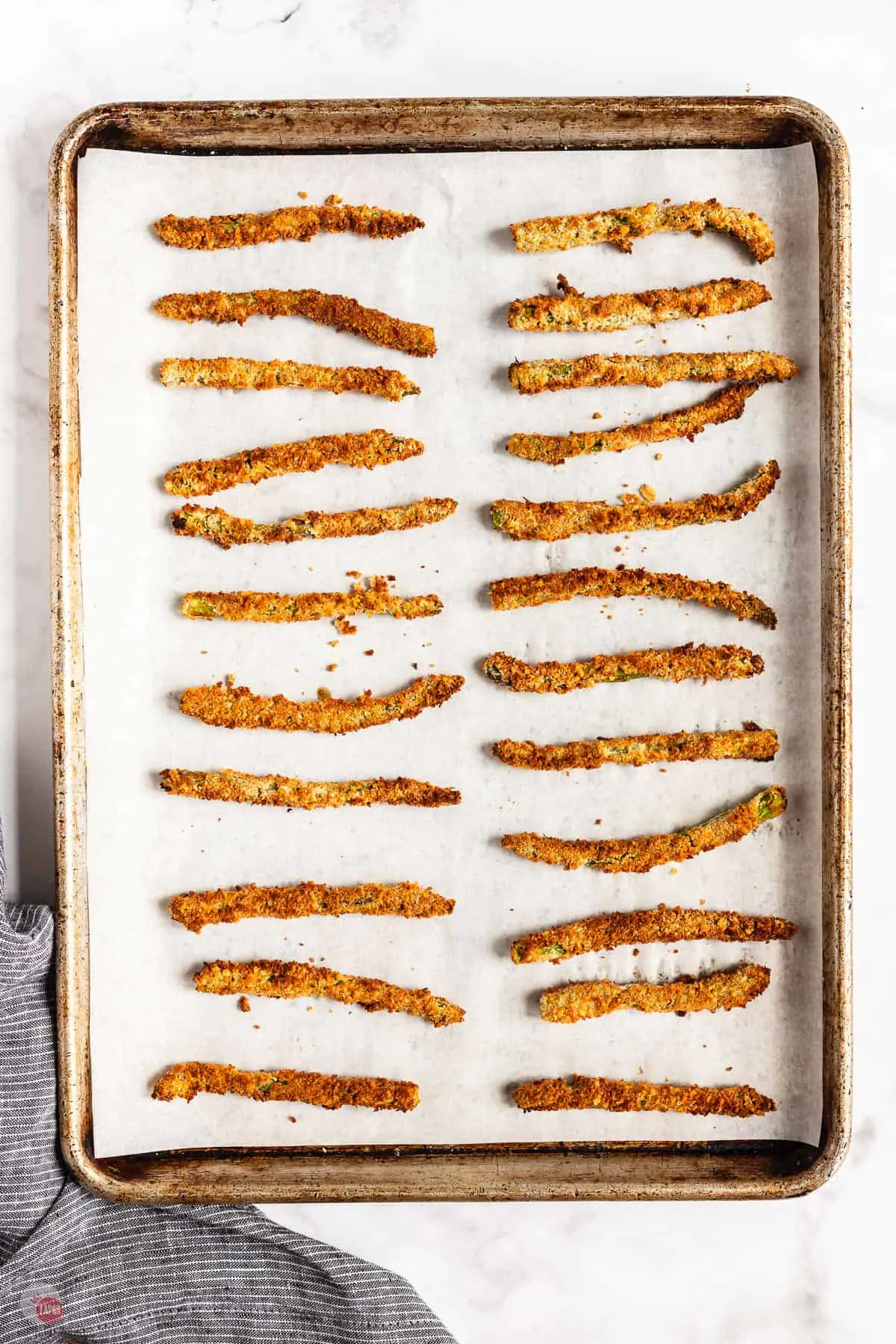 baked asparagus on a baking sheet