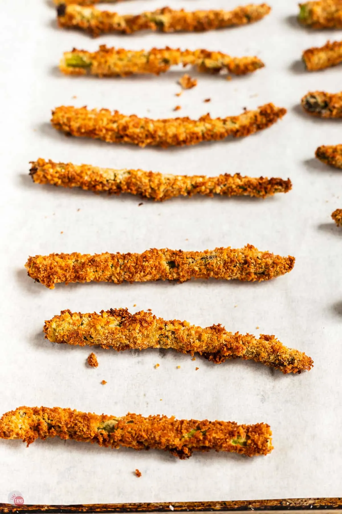 asparagus fries on a baking sheet