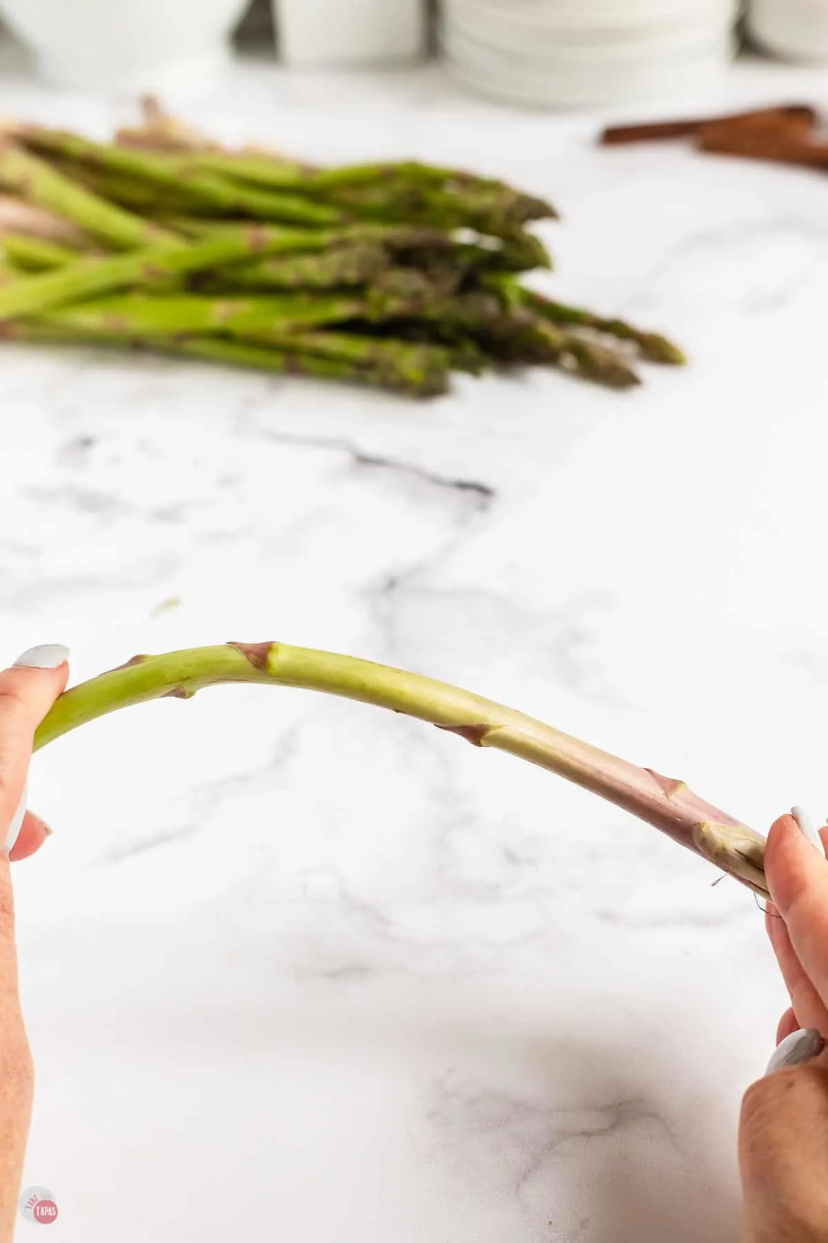 asparagus spear in two hands