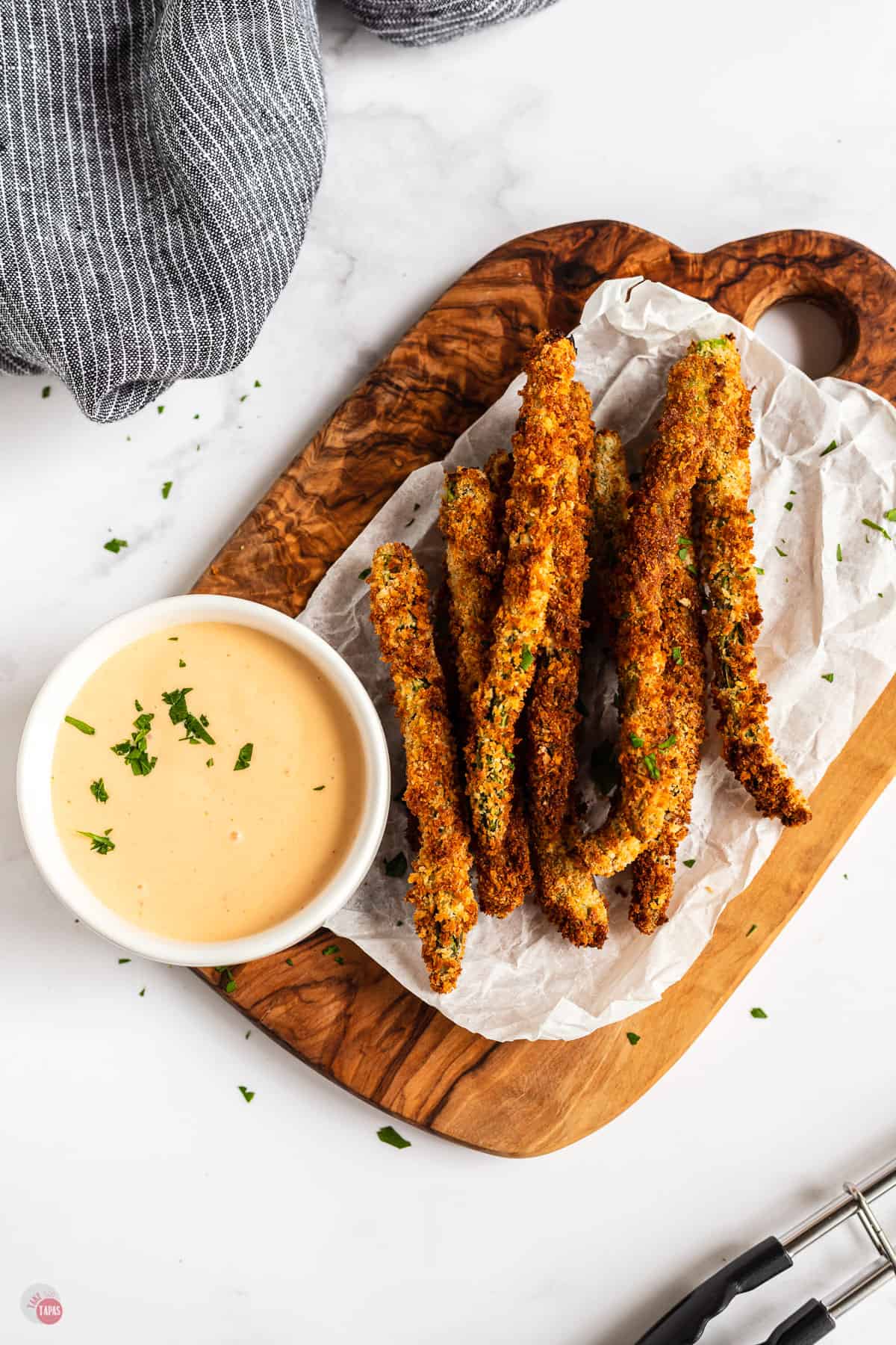 asparagus fries on a wood board