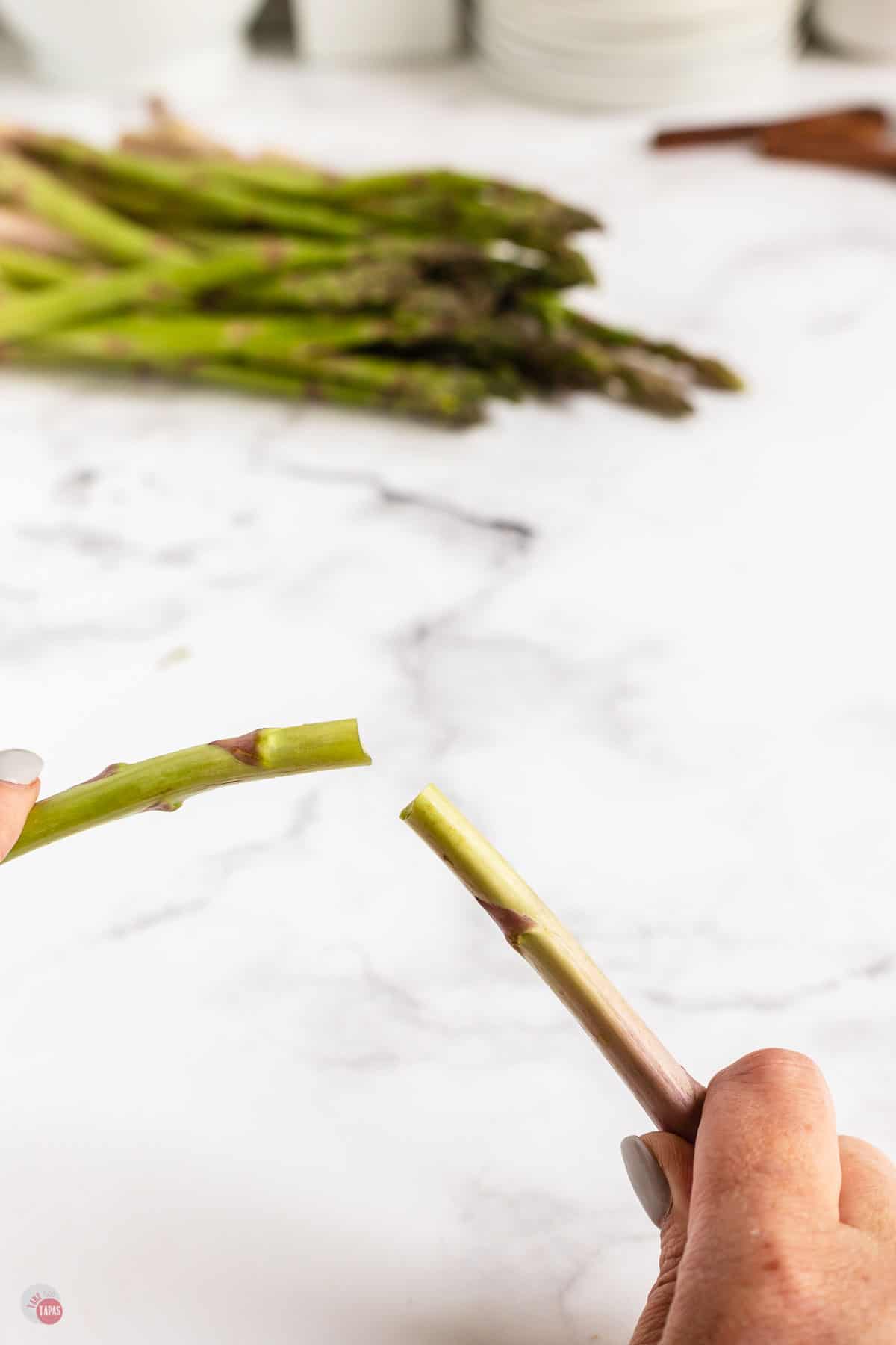 asparagus spear in two hands