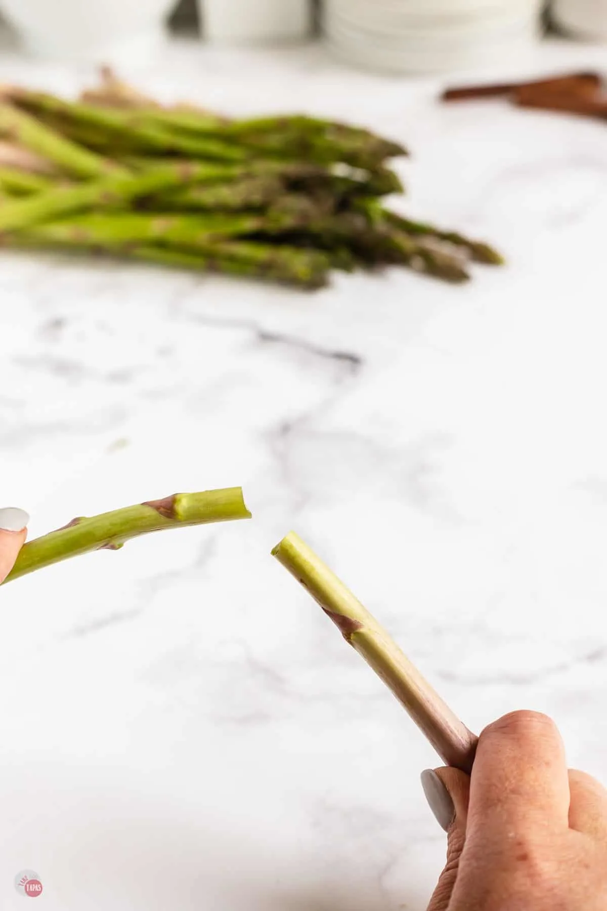 asparagus spear in two hands