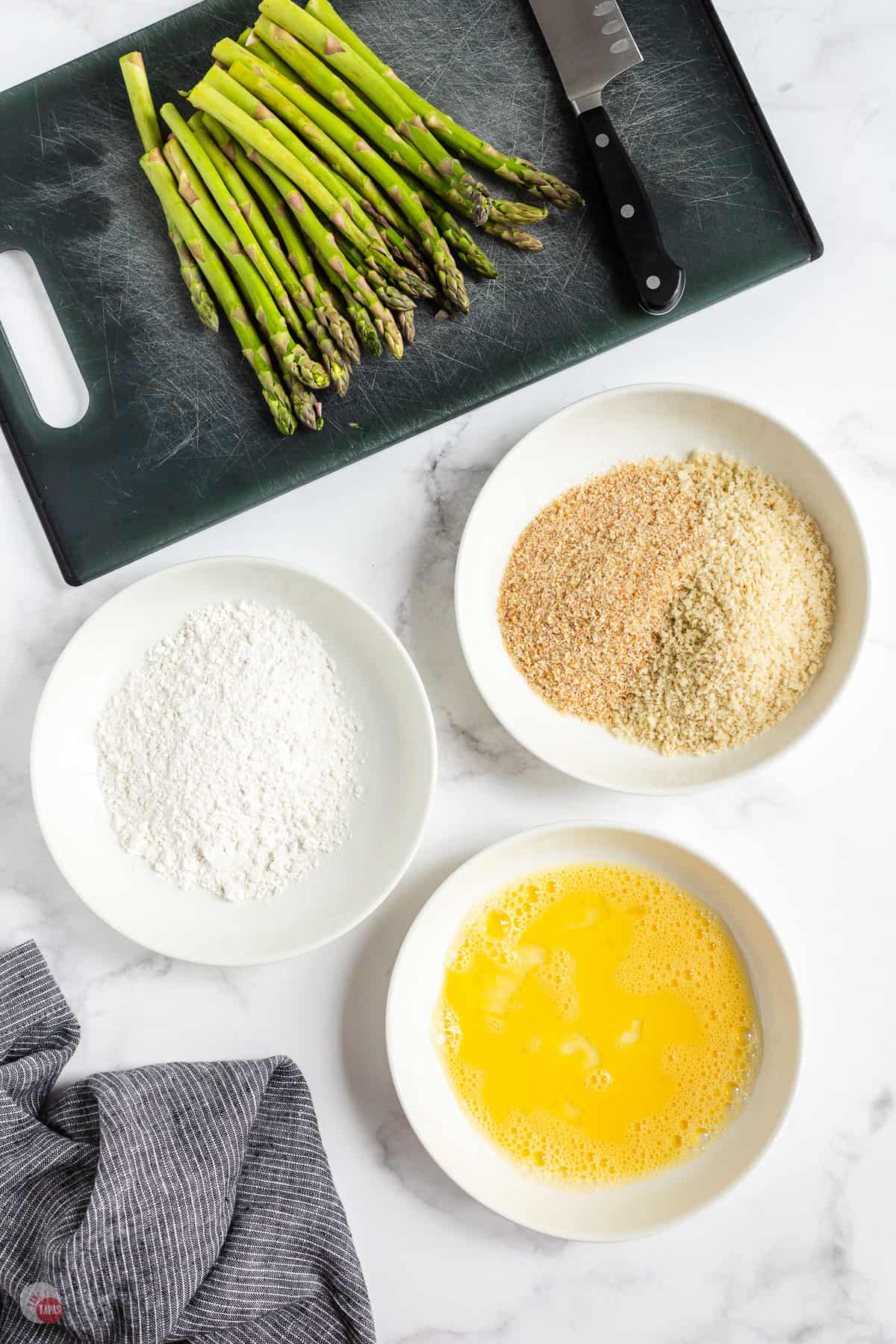 three plates of breading ingredients