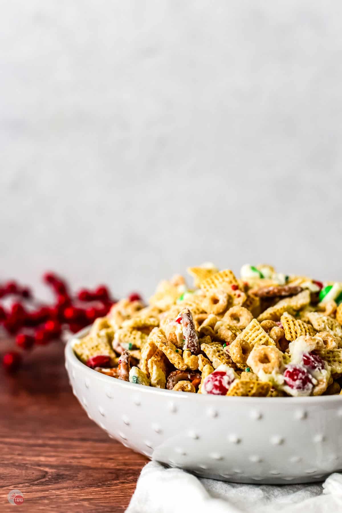 bowl of christmas crack chex mix with white chocolate