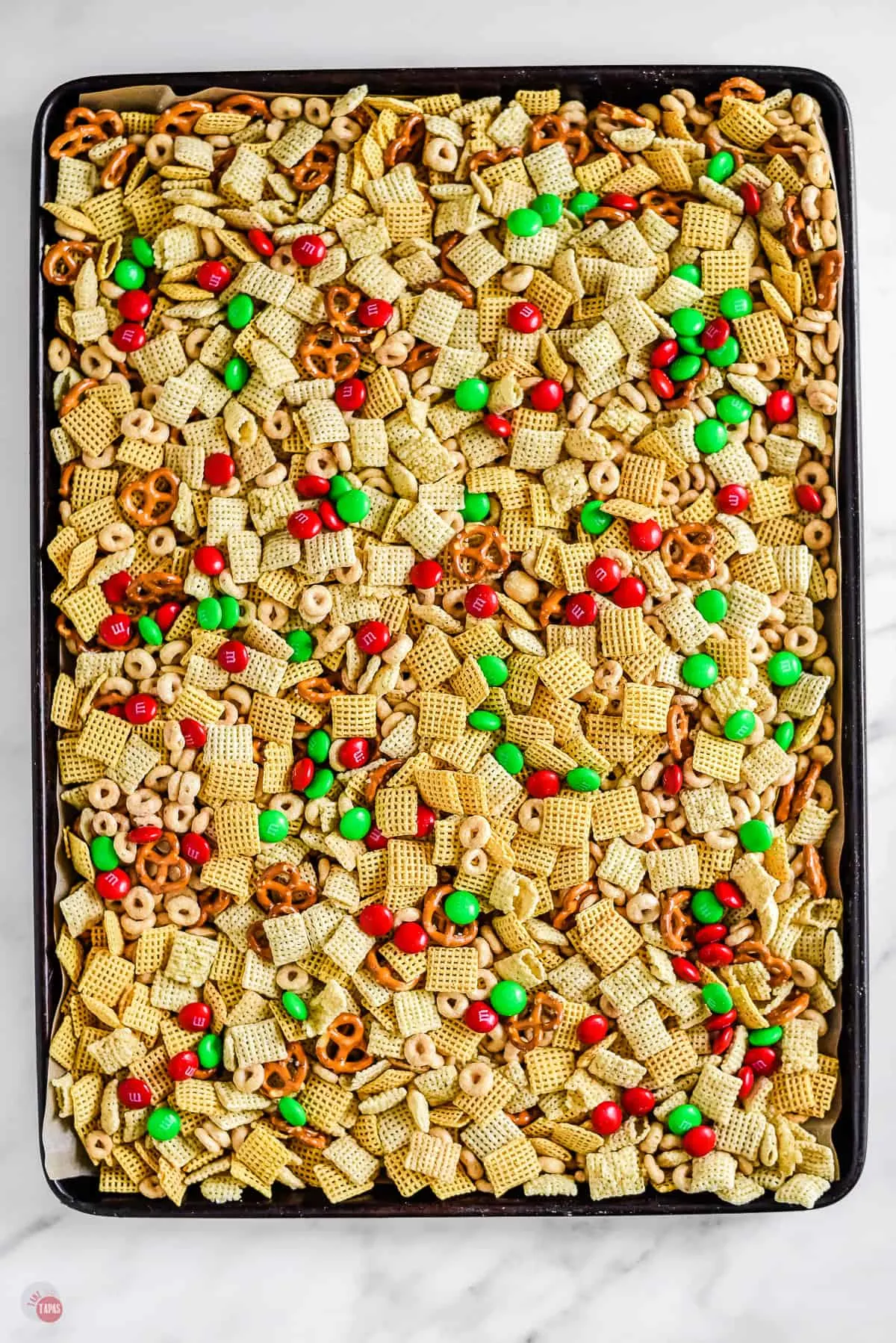 chex mix on a baking sheet