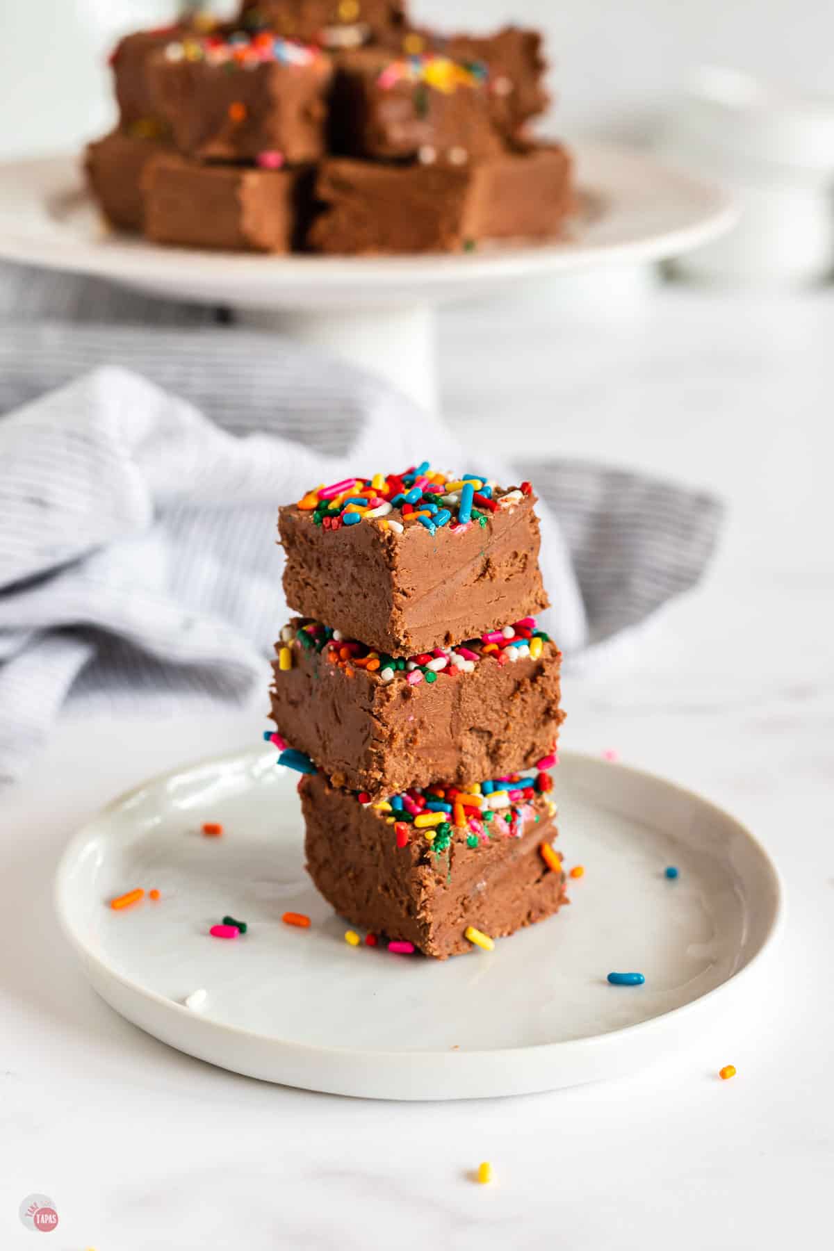 side view of stacked fudge on a plate