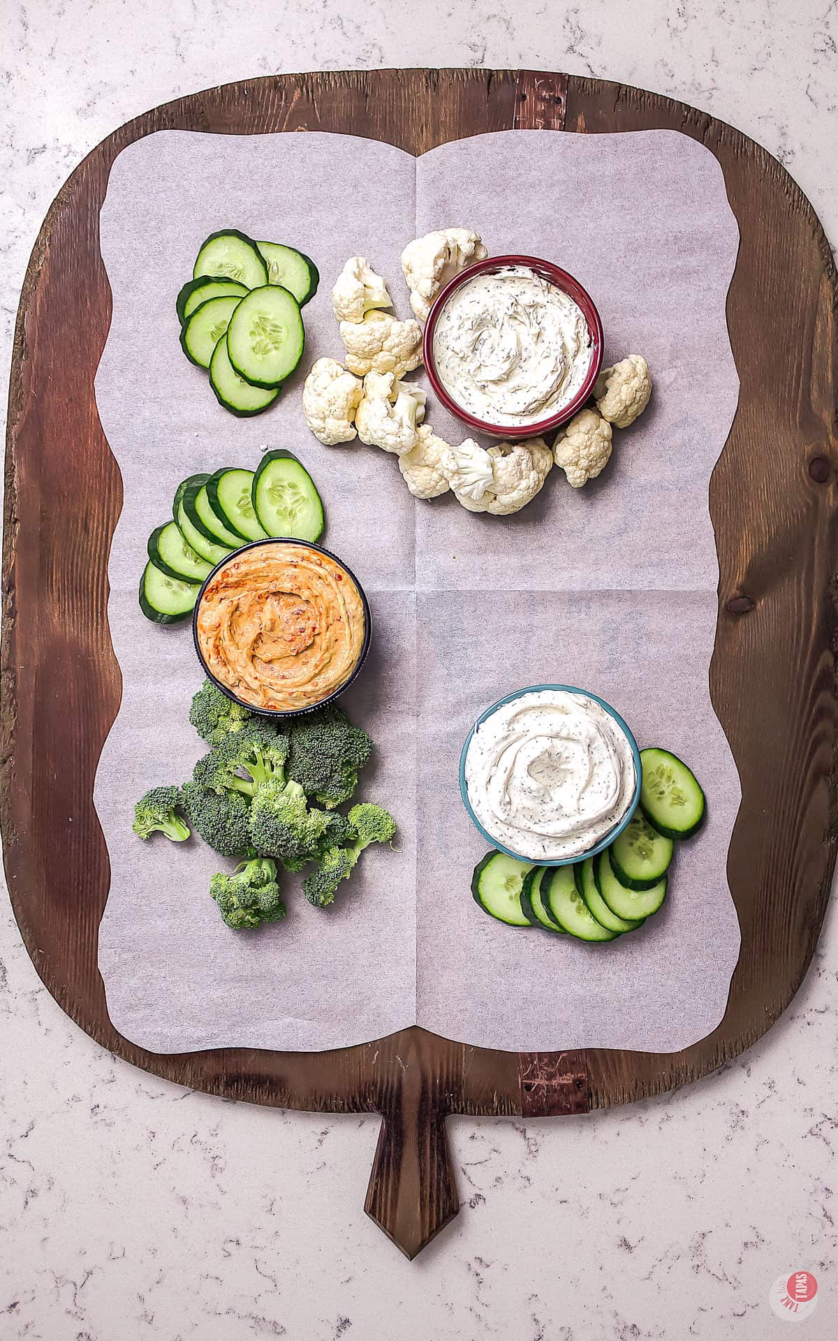 serving board with a few crudites and dips