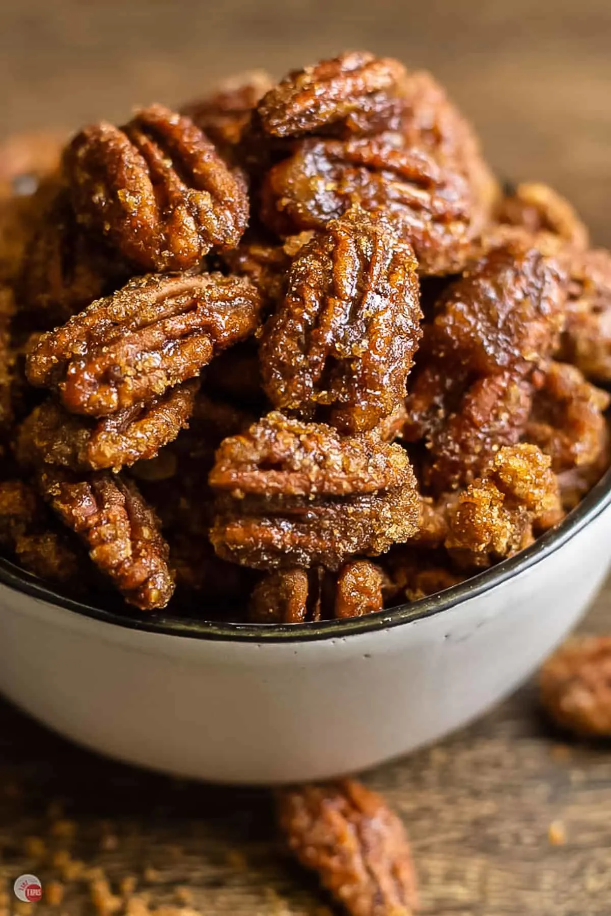 close up of candied nuts in a white bowl