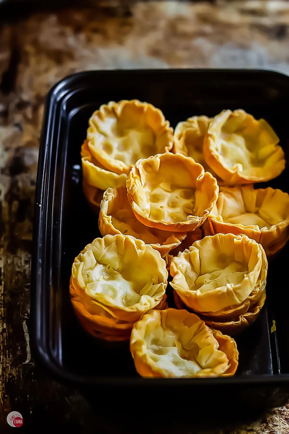 pastry cups in a food storage container