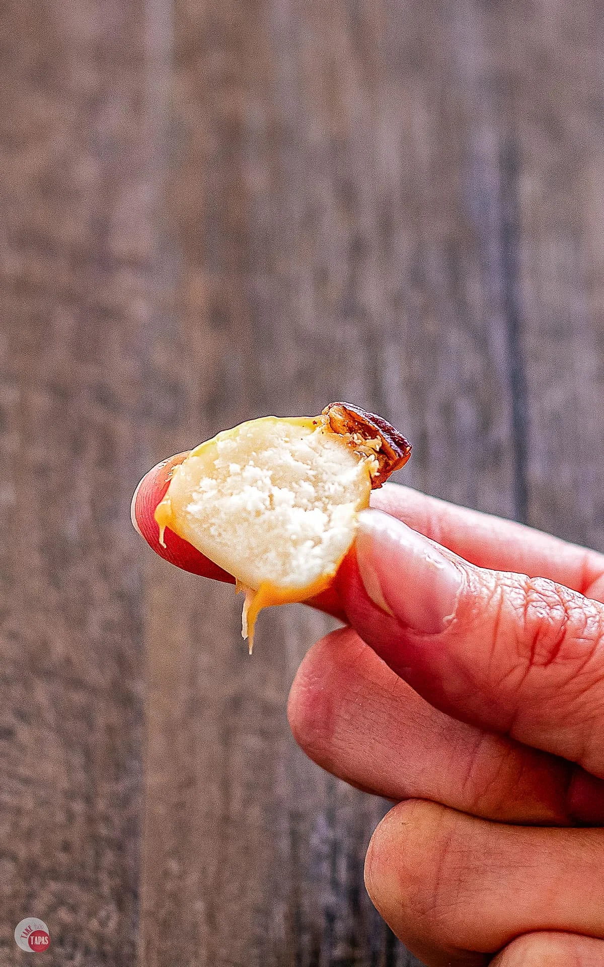 Person holding half a nougat ball