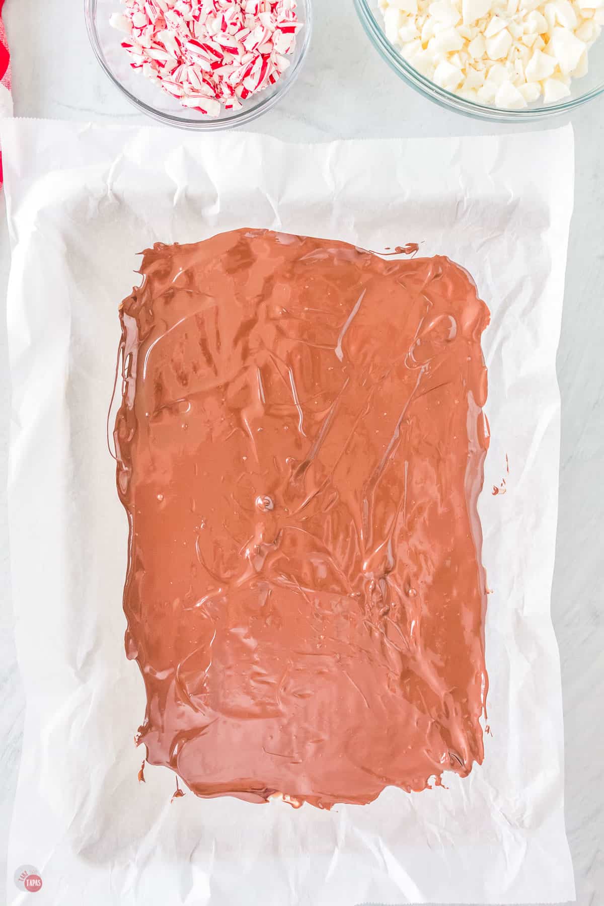 melted milk chocolate on parchment paper