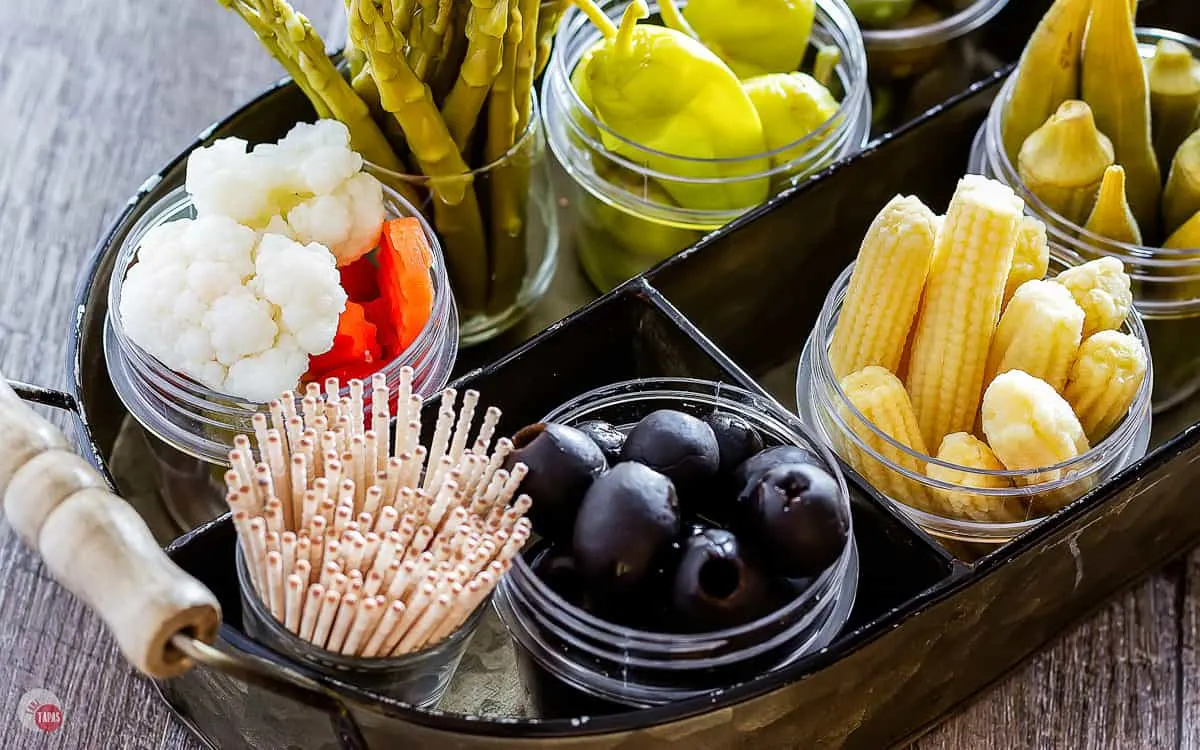 Close up of olives and toothpicks on a relish tray