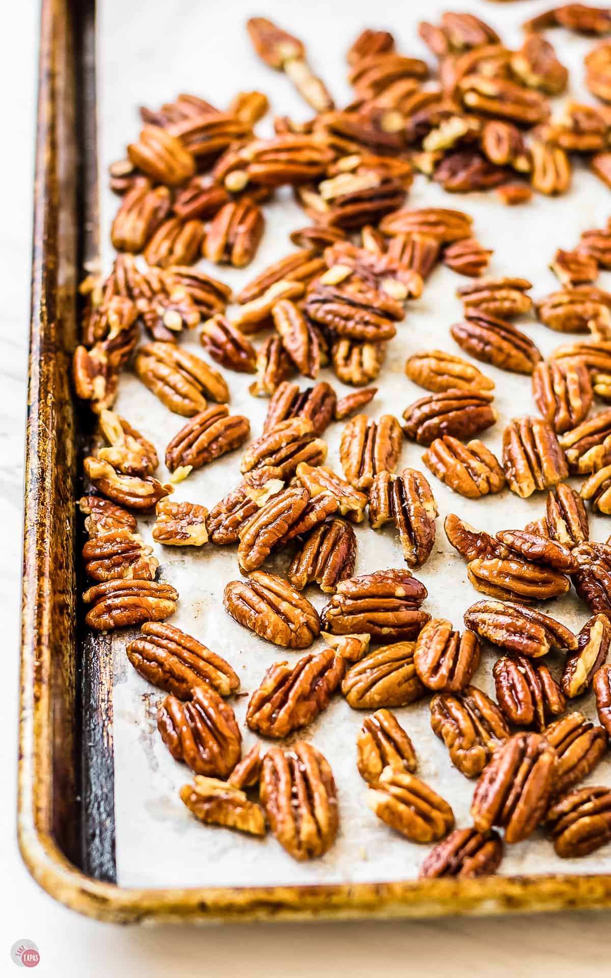 toasted pecans on a baking sheet