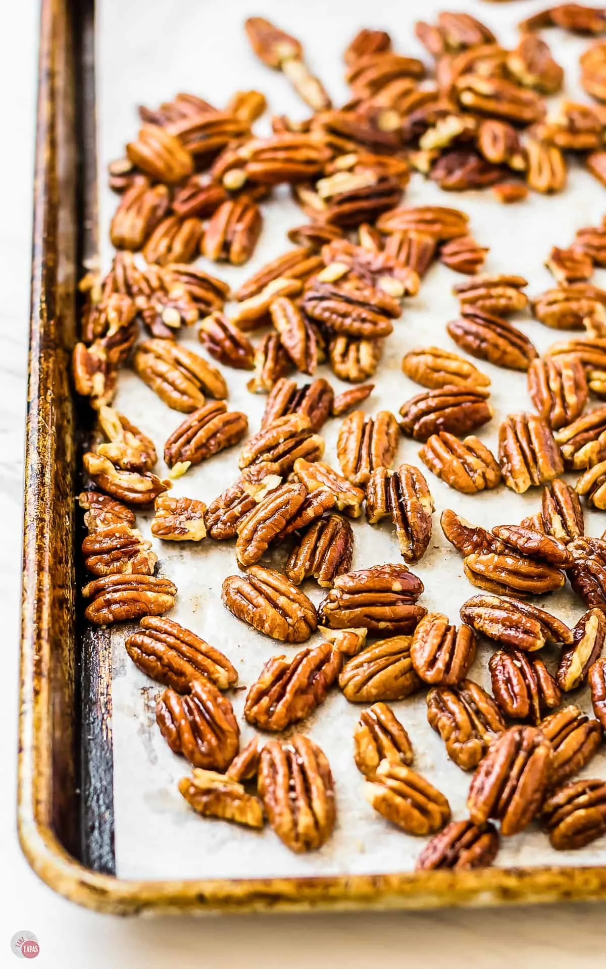 toasted pecans on a baking sheet